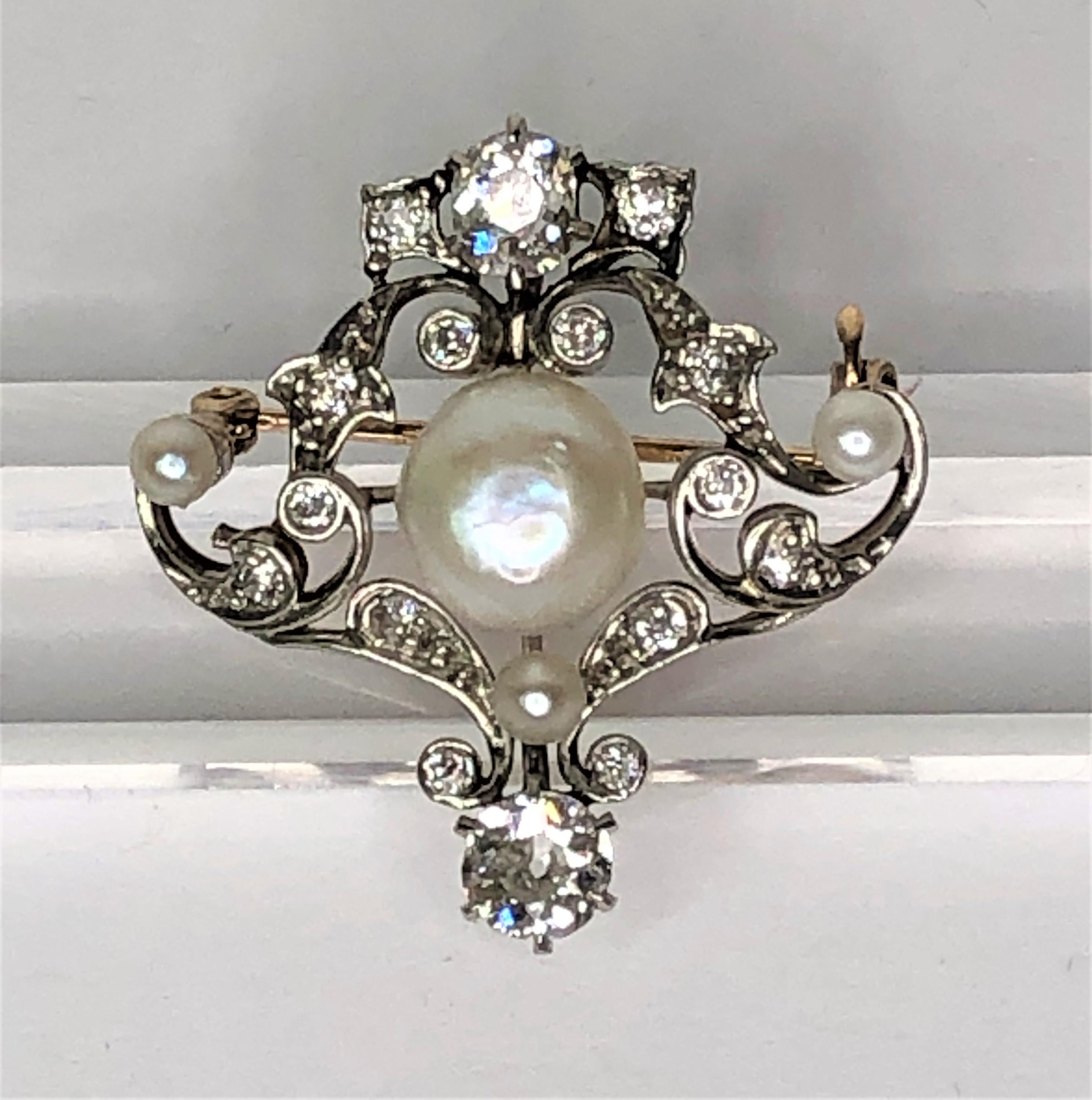 WOW- this is a one-of-a-kind special piece.  It's the perfect size for any outfit!
Platinum and 14 karat yellow gold setting.
4 total pearls ranging from approximately 3mm - 9mm
Diamonds range from approximately .03 to .50ct in size.  F-G color, VS