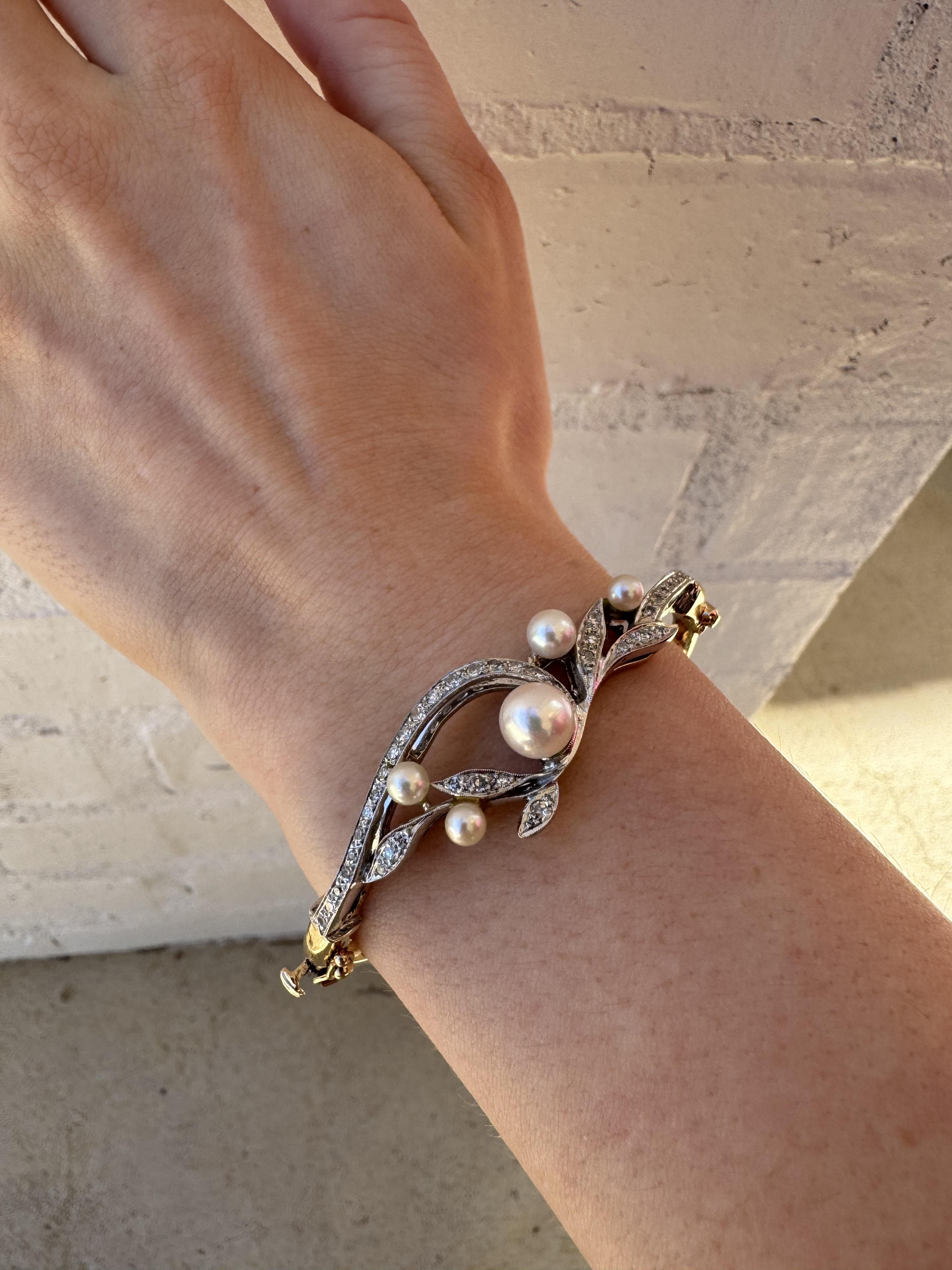 We always love the combination of diamonds & pearls!
This bracelet is simply perfect! Great unique style!!

Bracelet Details
Material: 14K Yellow & White Gold
Wrist Size: Average 7 Inch
Weight: 16.3 Grams
Head Width: 17mm

Accented by the following