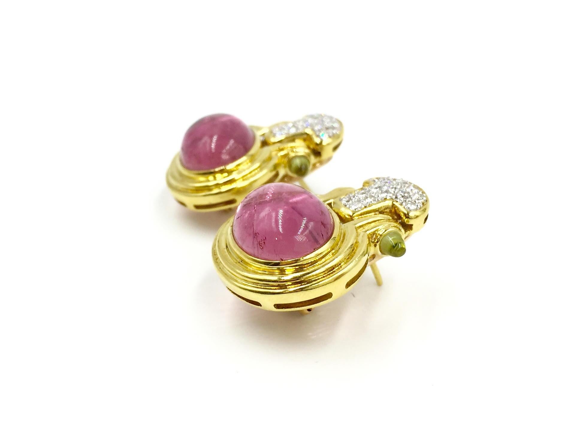 Gorgeous colorful 18 karat yellow gold earrings with natural pink tourmaline, white diamonds and peridot gemstones. Diamond quality is approximately G color, SI1 clarity at approximately .35 carats total weight, set in white gold to give them an