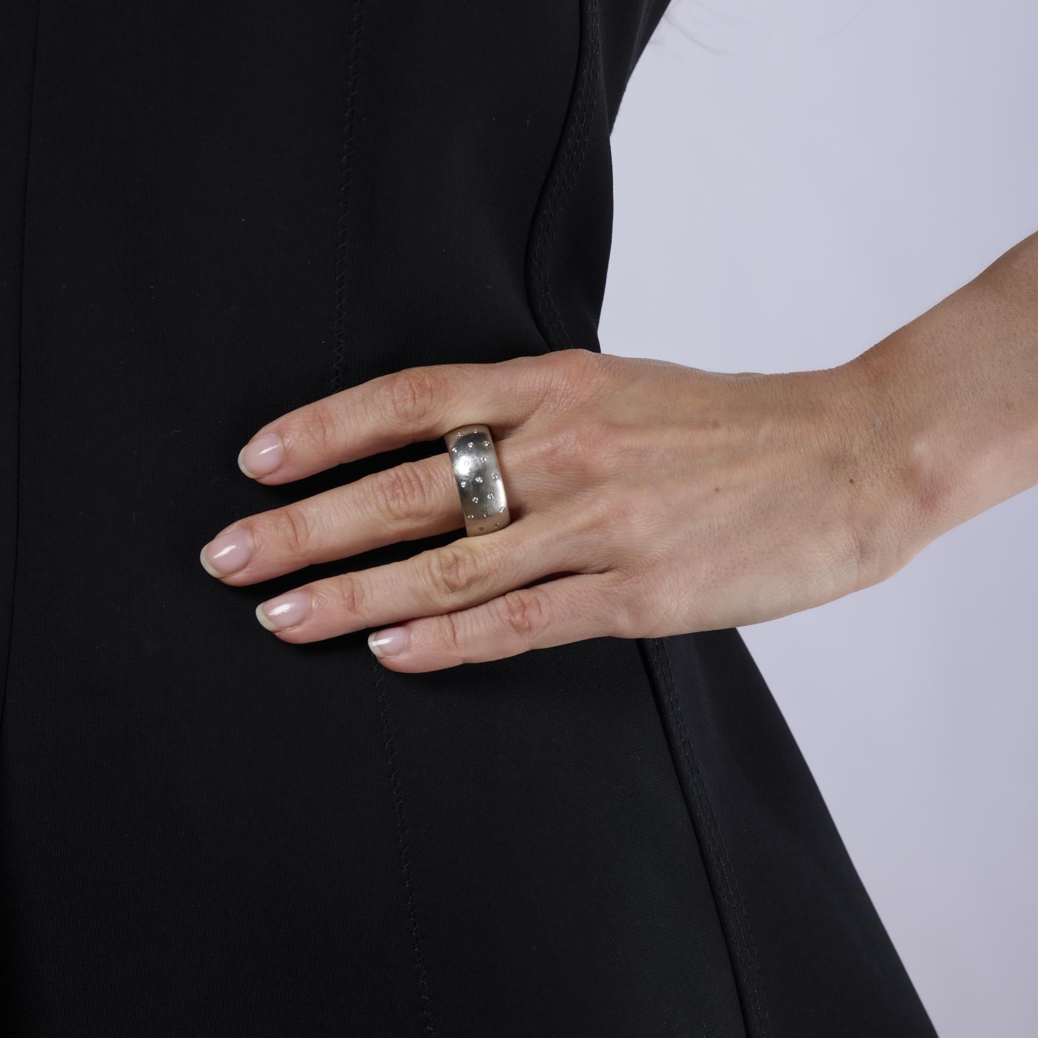 This stylish vintage ring features 50 sparkling round brilliant cut diamonds set in a bold combination of platinum and 18k yellow gold. A striking 1980s design that blends luxurious detail with timeless sophistication.
