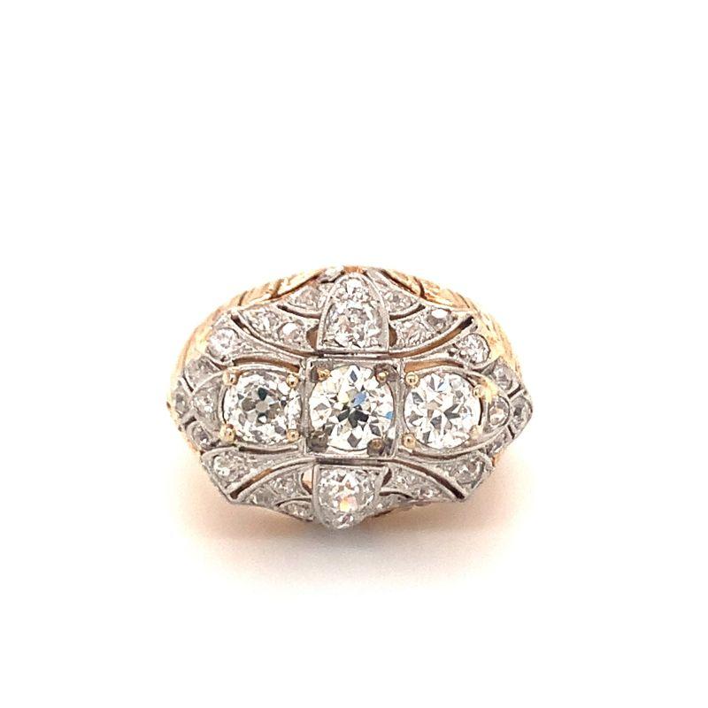 One vintage diamond platinum topped, 18K yellow gold ring featuring 29 old European cut diamonds totaling approximately 2.50 ct. with gold bead workmanship. Art Deco motif top portion, circa 1960s. Exquisite, sophisticated, dashing.

Additional