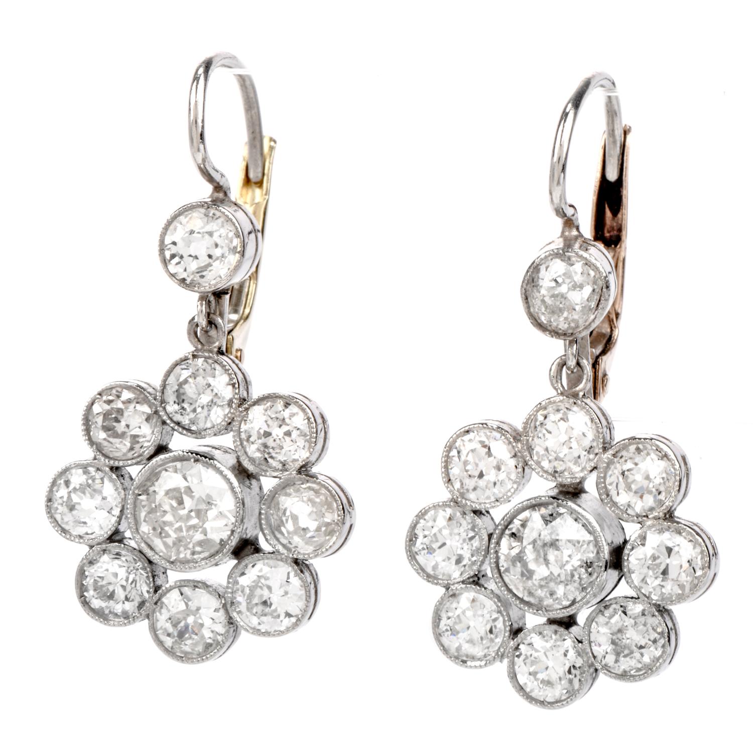 Accent your look with the exquisite Pristine Condition Floral

Designed cluster earrings crafted in Platinum.

earrings consists of a 18-0ld European-cut diamond floral cluster suspended

Form a single diamond at the base of the Earoclip hoop.

The
