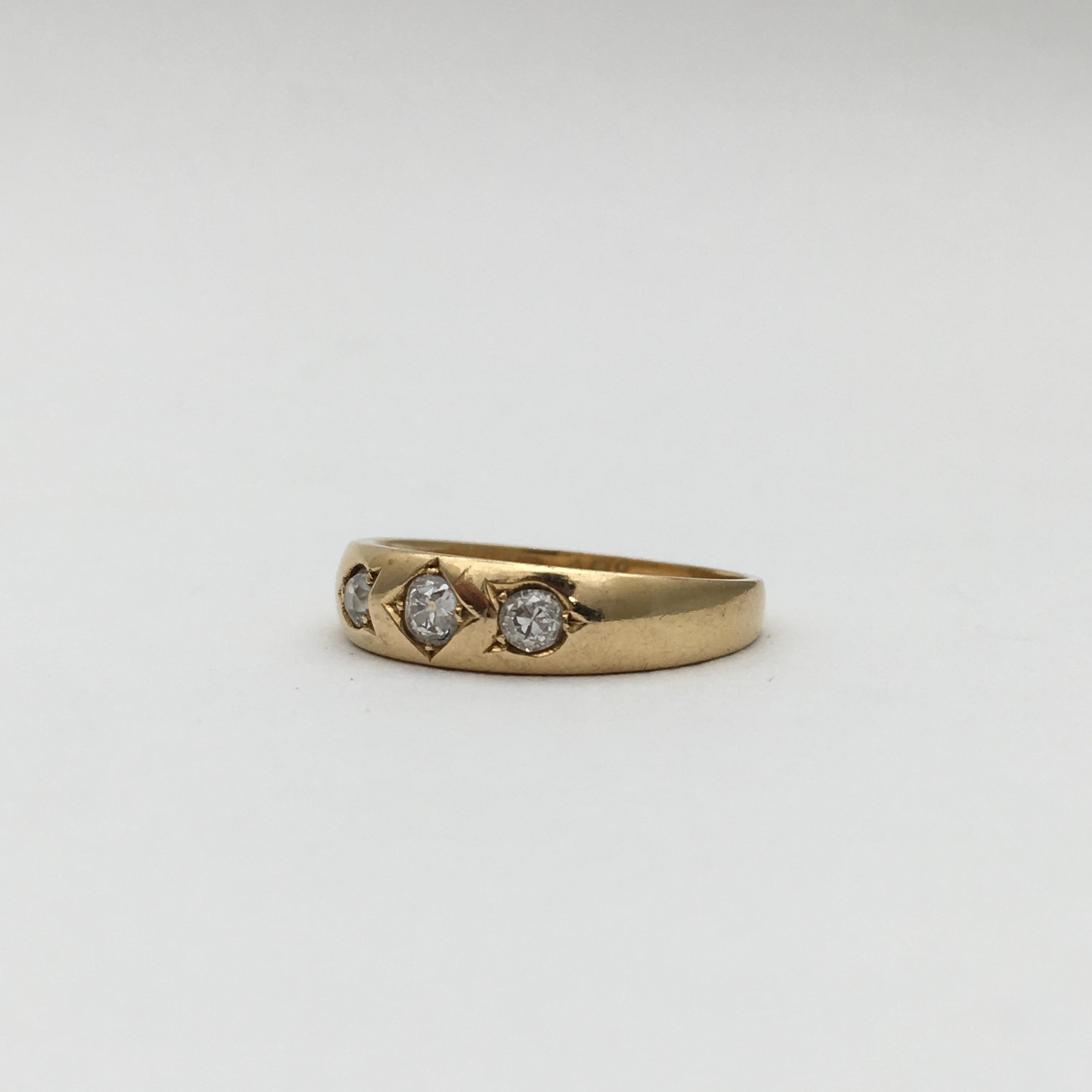 This beautiful diamond ring dates from 1910. The stylish design has a contemporary look and feel, which makes it as desirable today as when it was made in London in the Edwardian era. The diamonds are Old European Cut and set in the 'gypsy' style