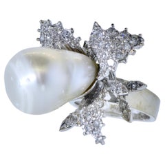 Used Diamond Ring centering a fine Baroque Pearl, circa 1960