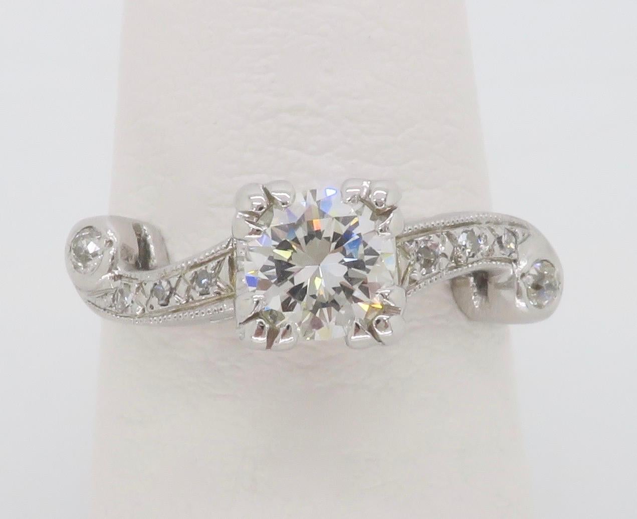 Vintage diamond engagement ring featuring a .50CT Round Brilliant cut diamond. 

Center Diamond Carat Weight: .50CT
Center Diamond Cut: Round Brilliant 
Center Diamond Color: I-J
Center Diamond Clarity: VS1
Total Diamond Carat Weight: 0.64CTW
Accent