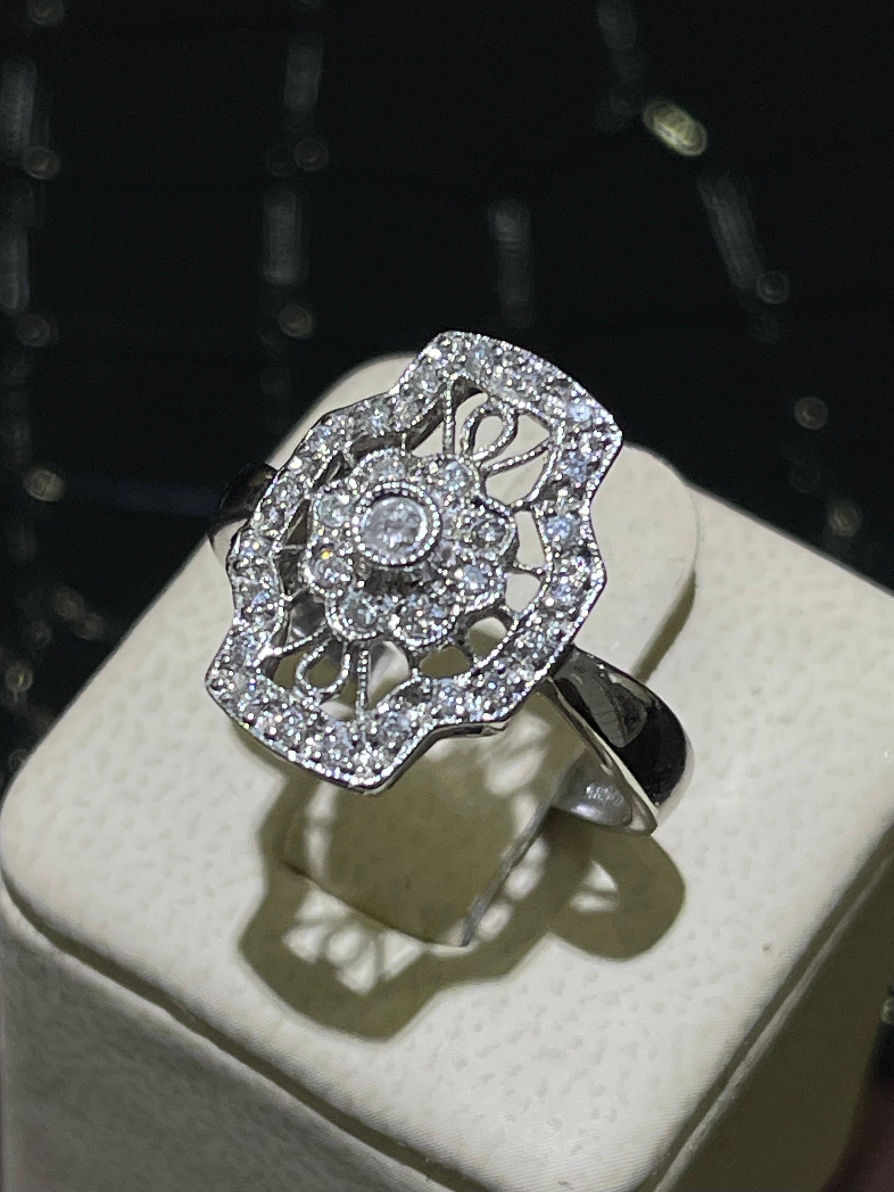 Vintage Diamond Ring In 14k White Gold. Approximately 0.3 carats in diamonds.

Size 7.5.