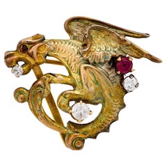 Vintage diamond ruby 10k yellow gold gryffin brooch