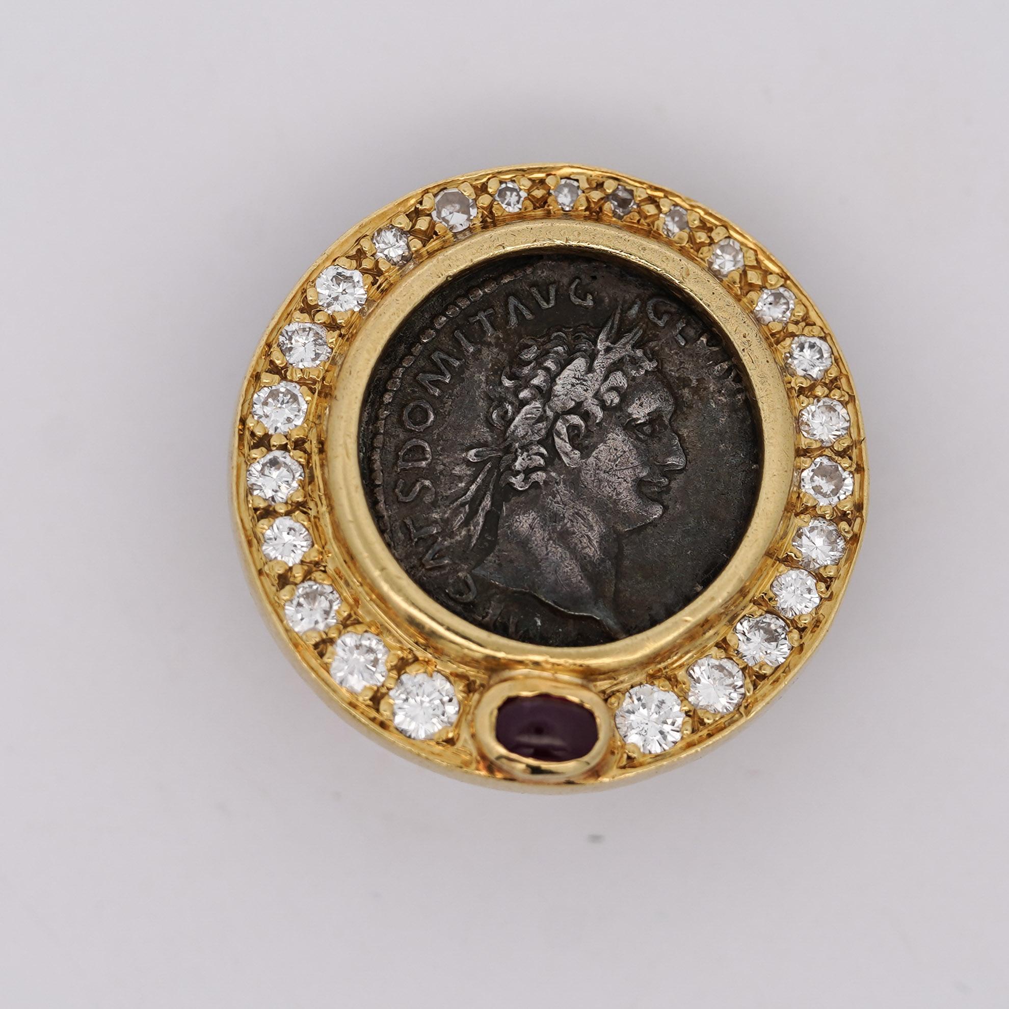 Get the earrings that no one else has. A striking blend of history and luxury, these 18K yellow gold clip-on earrings feature Roman silver coin replicas, encased in a diamond-studded bezel with a ruby cabochon accent. Designed for non-pierced ears,