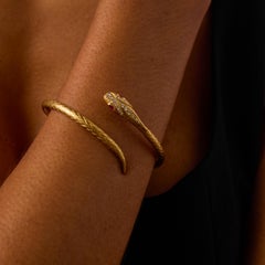 Vintage diamond ruby 18k yellow gold flexible snake bangle