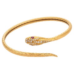 Vintage diamond ruby 18k yellow gold flexible snake bangle