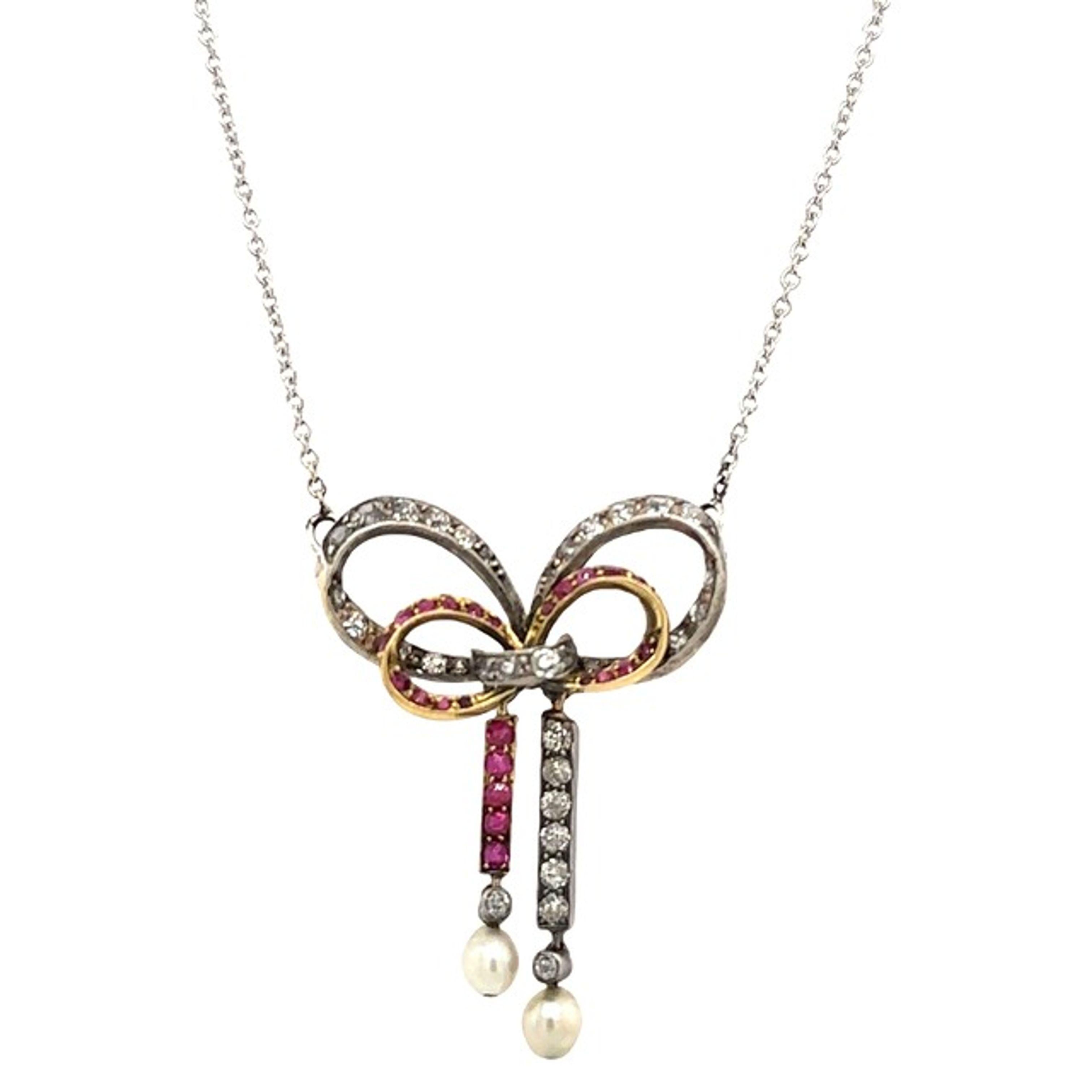 This gorgeous vintage Diamond, Ruby and Pearl pendant  is set with  0.50ct of rose cut Diamonds in 8ct yellow gold and silver on back of the pendant, The pendant is suspended from a 14ct white gold chain that measures 18