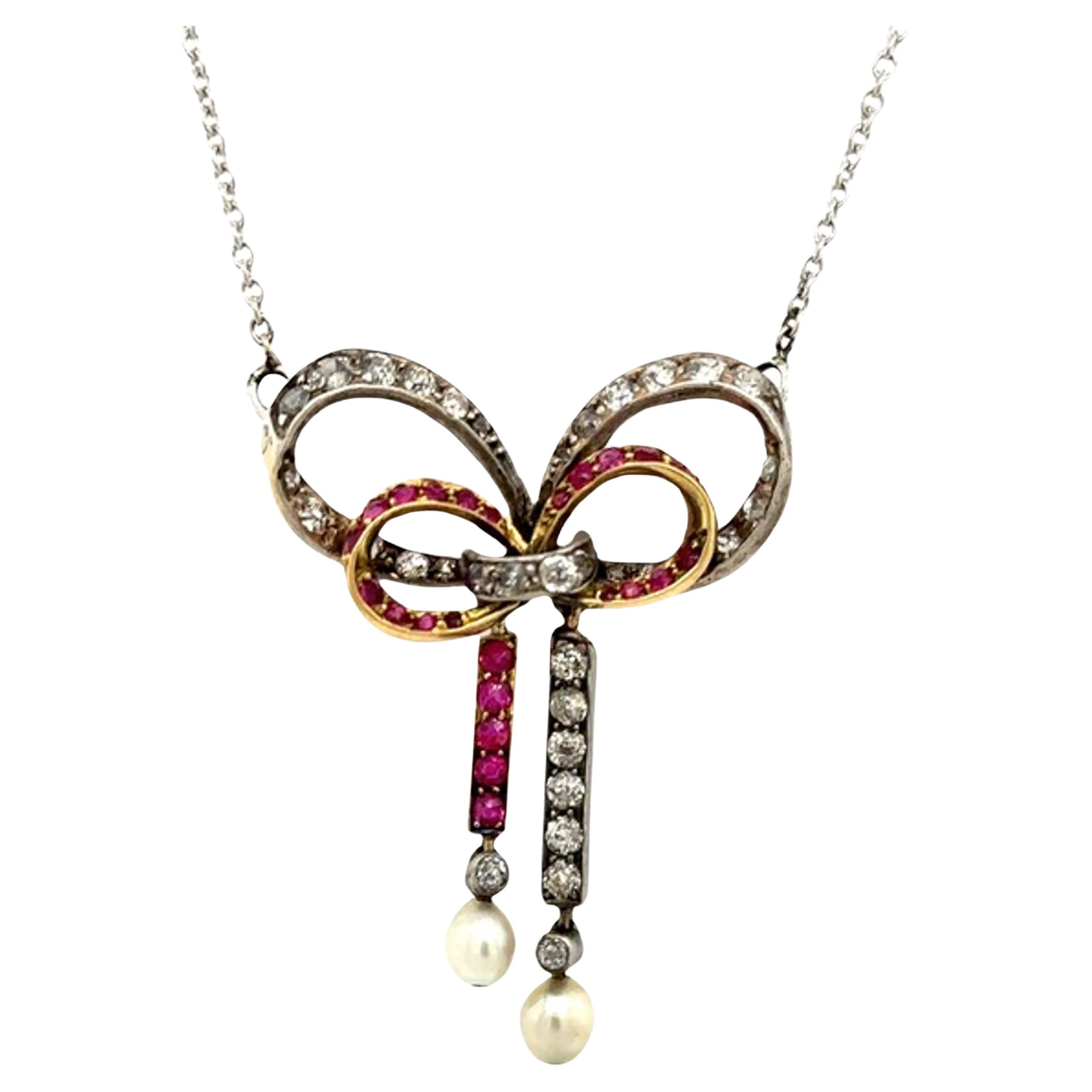 Vintage Diamond & Ruby Bow Pendant Suspended from 14ct Gold Chain For Sale