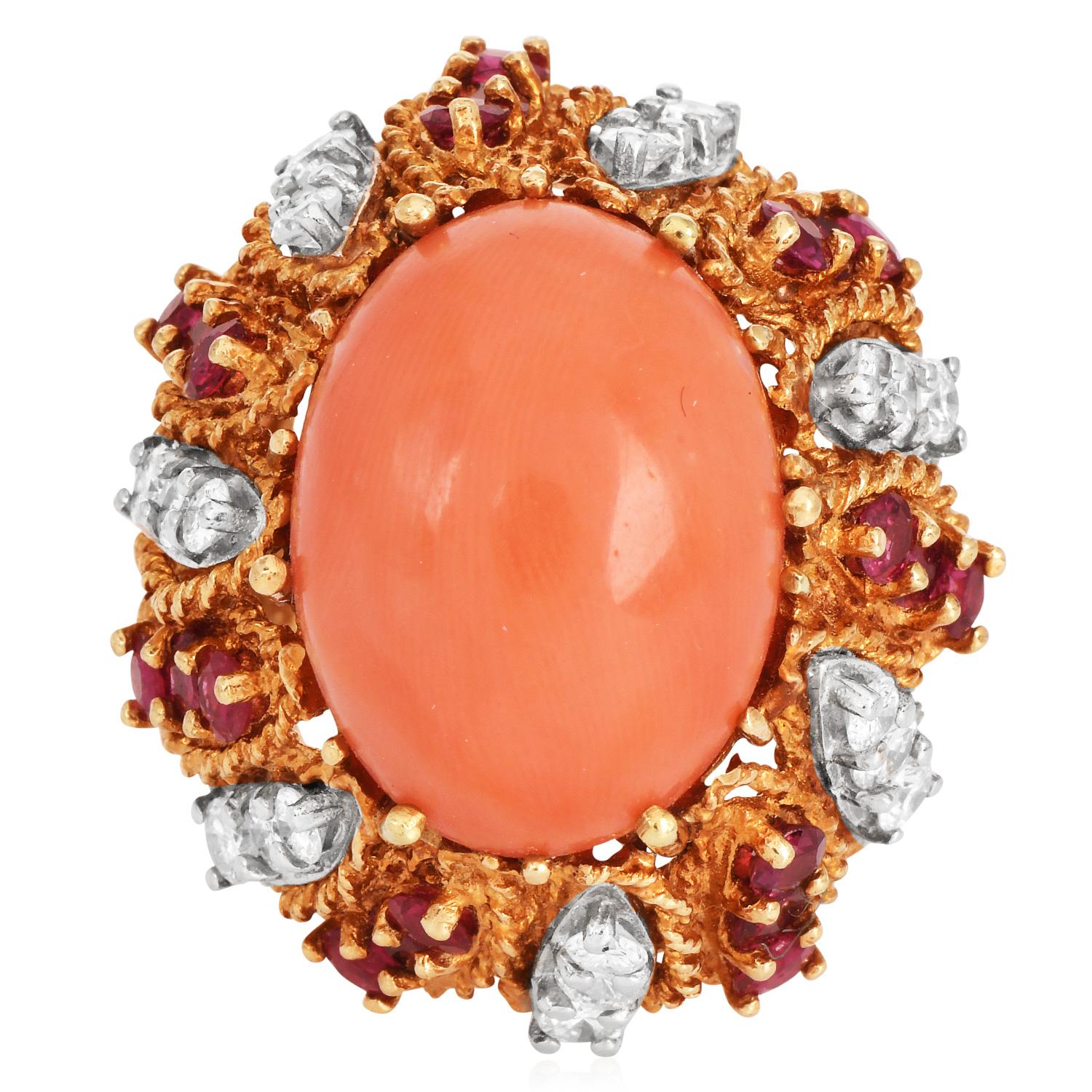 
This stunning Hand-made 1960s vintage cocktail ring is crafted in solid 18K yellow gold, weighing 22.1 grams and measuring 31mm wide x 18mm high. This ring exposes at the center an enchanting oval cabochon of genuine natural salmon color Genuine