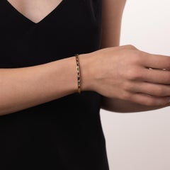 Vintage diamond ruby emerald sapphire 14k yellow gold bangle
