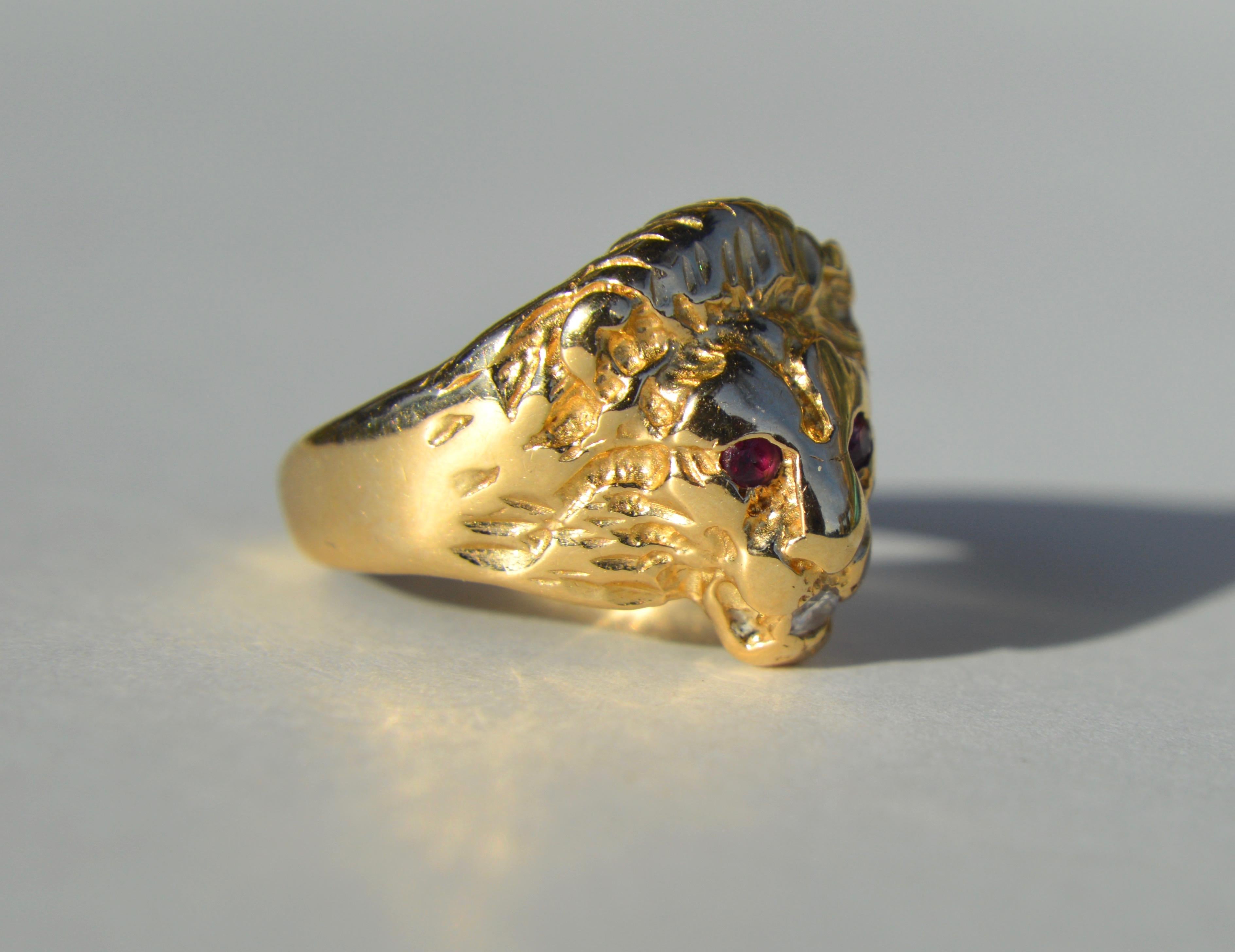 Beautiful vintage circa 1970s 14K yellow gold with diamond and ruby lion cocktail statement ring. Perfect for that Leo in your life. Size 8, can be resized by a jeweler. In very good condition. Ring is unmarked but tested as solid 14K. Lion head