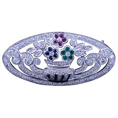 Vintage-Brosche mit Diamanten, Rubinen, Saphiren und Smaragden in Blumenform aus 18-karätigem Weißgold