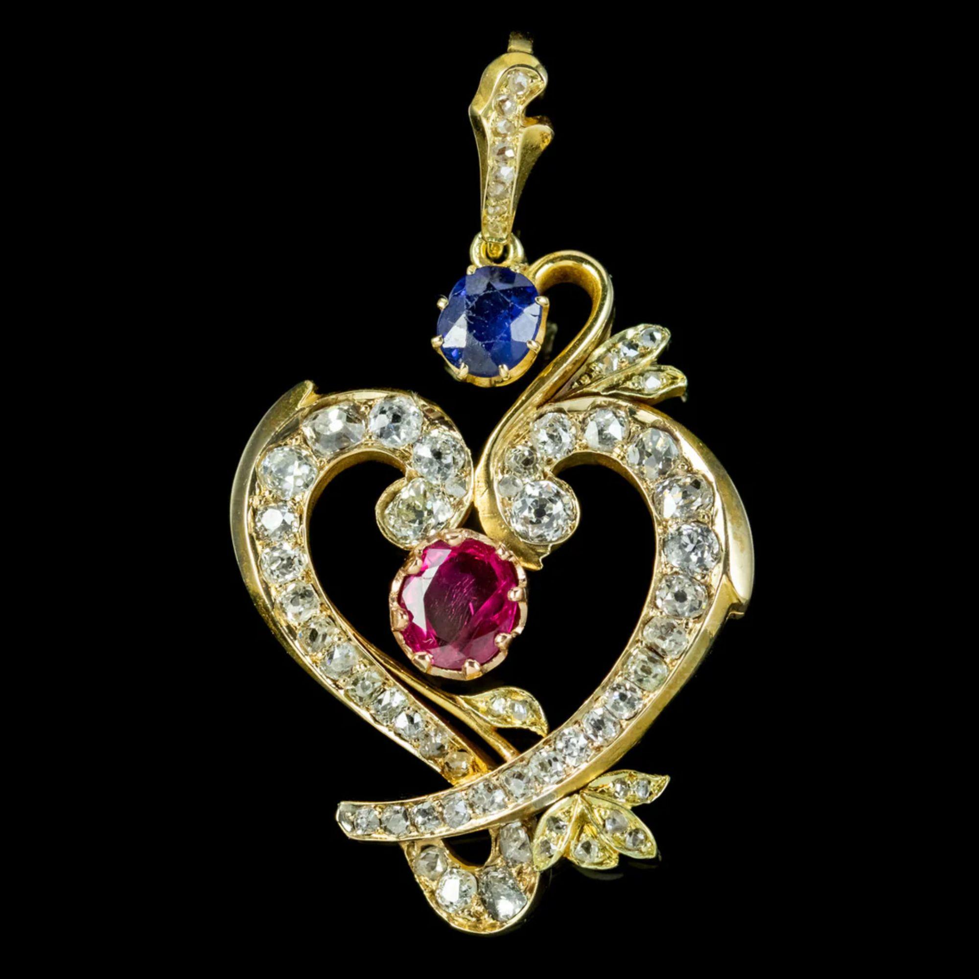 A gorgeous vintage heart pendant lined with a dazzling array of bright, old mine cut diamonds (approx. 3ct total) and claw set with a blue sapphire at the top (approx. 0.60ct) and a pink ruby in the centre (approx. 0.90ct).

The piece is all 18ct