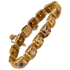 Vintage Diamond Sapphire and Ruby 18 Karat Yellow Gold Link Bracelet