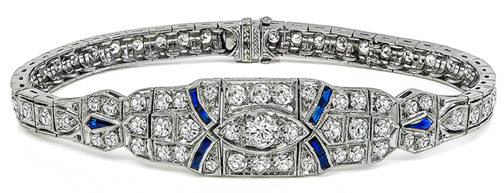 This amazing platinum bracelet from the art Deco era is set with sparkling round cut diamonds that weigh approximately 3.00ct. graded G color with Vs clarity. The diamonds are accentuated by lovely sapphire accents. The bracelet measures 6 3/4