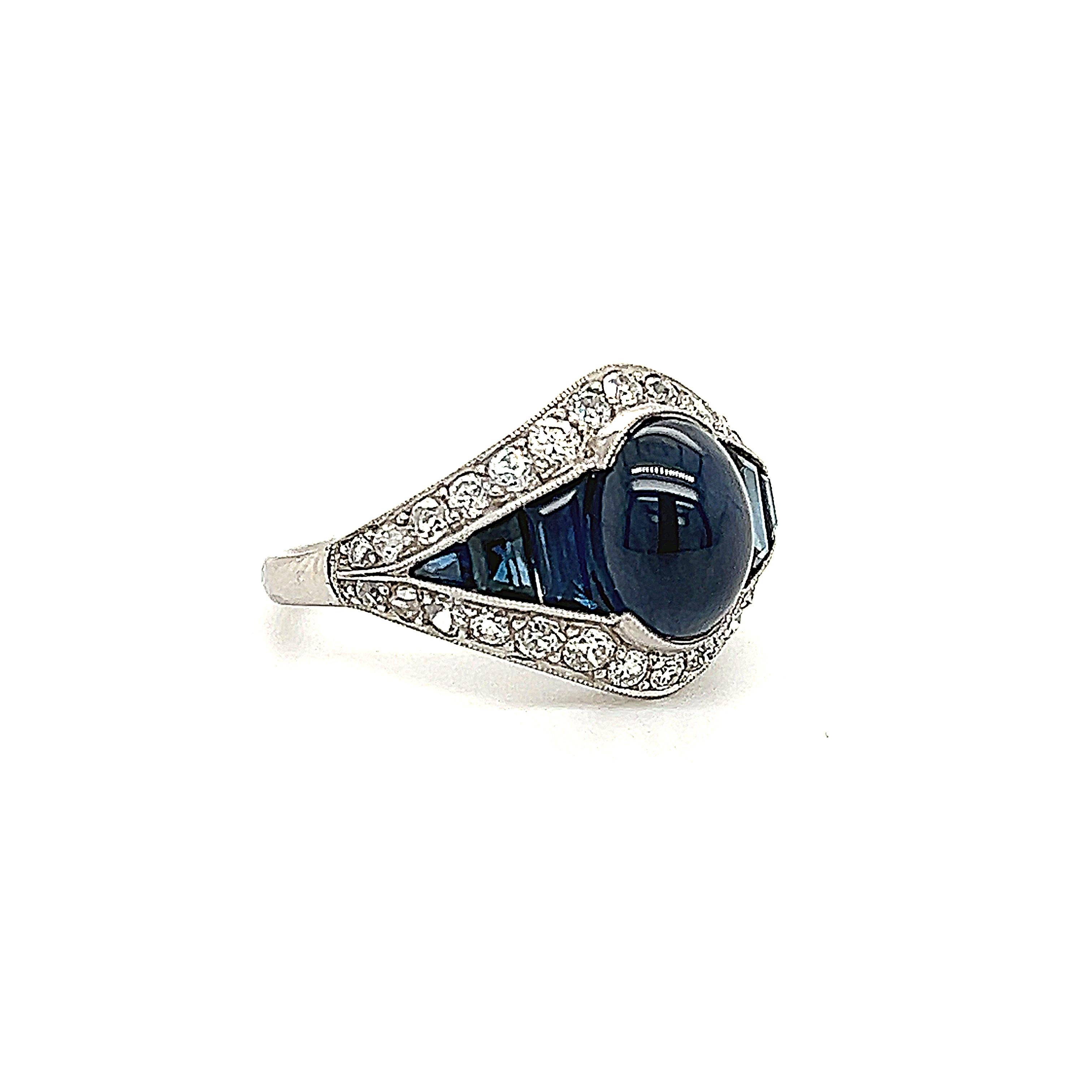 Wonderful creation crafted in 18k white gold. Styled after the art deco time period this ring is truly breathtaking and a real show stopper. The ring shows a unique design as diamond and sapphire gemstones are set perfectly making this ring a true