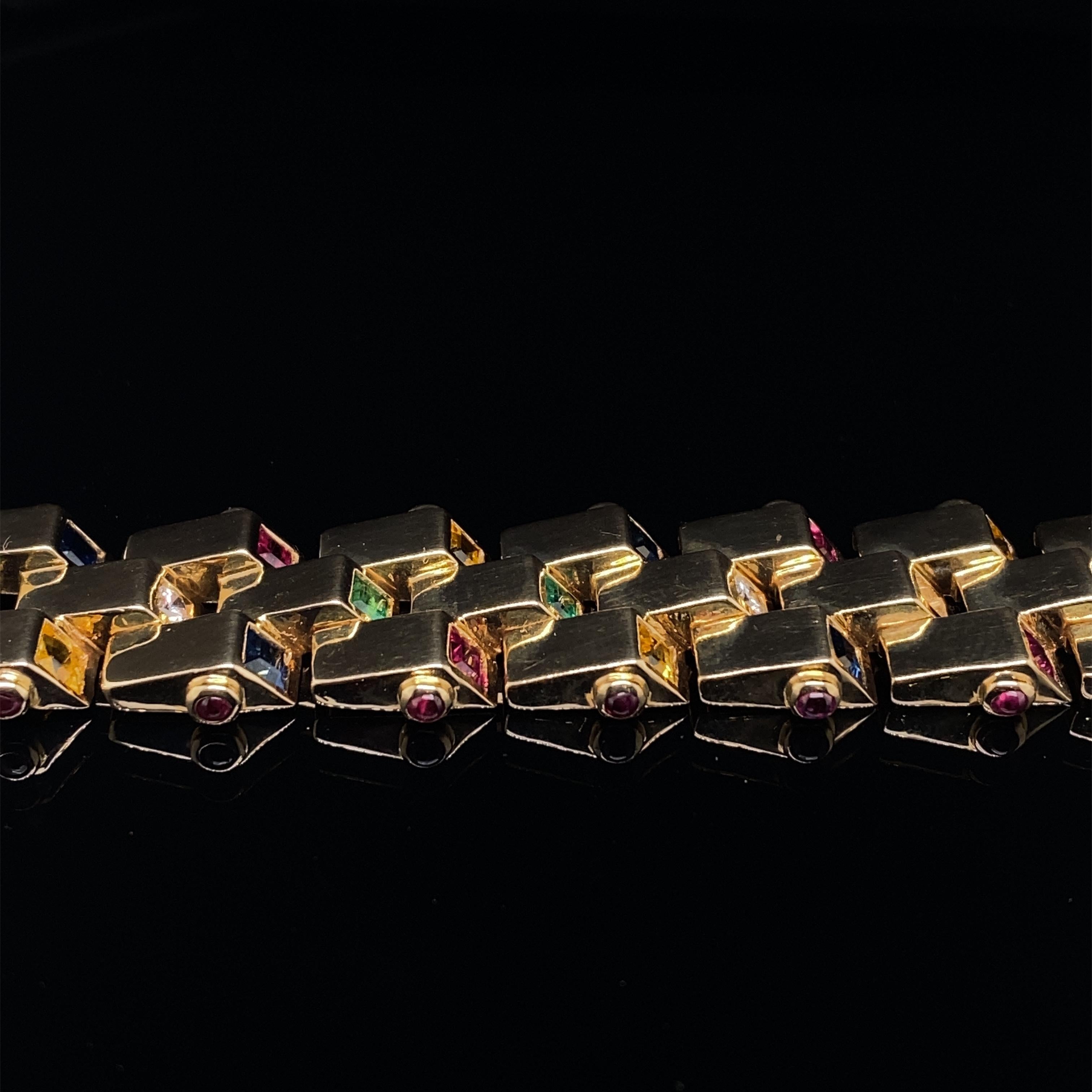 An exceptional vintage 18 karat yellow gold bracelet, set with square cut diamonds, sapphires, emeralds, rubies and citrines, circa 1960.

This bold and playful piece is comprised of three angular 18 karat yellow gold rows, each linked section