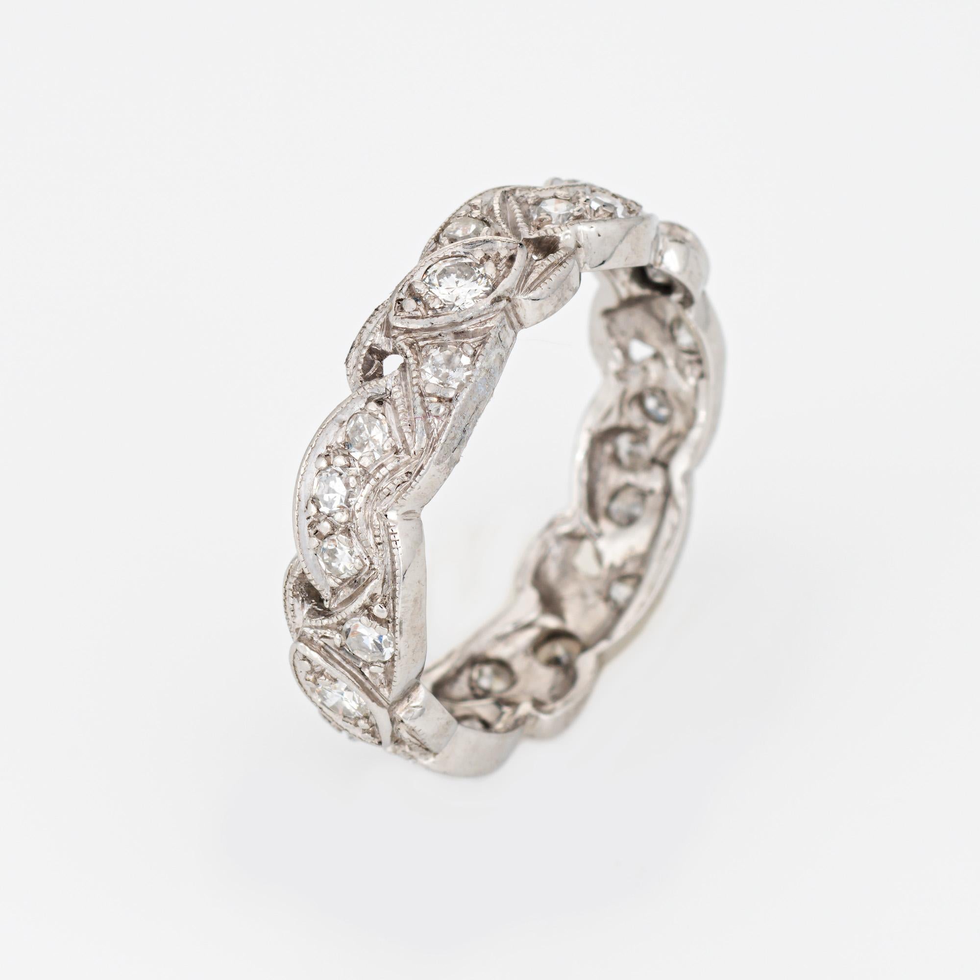 Stylish vintage scrolled diamond band (circa 1950s) crafted in 900 platinum. 

Round brilliant & single cut diamonds total an estimated 0.40 carats (estimated at H-I color and VS2-SI2 clarity). 

The charming Mid Century scrolled ring is set with