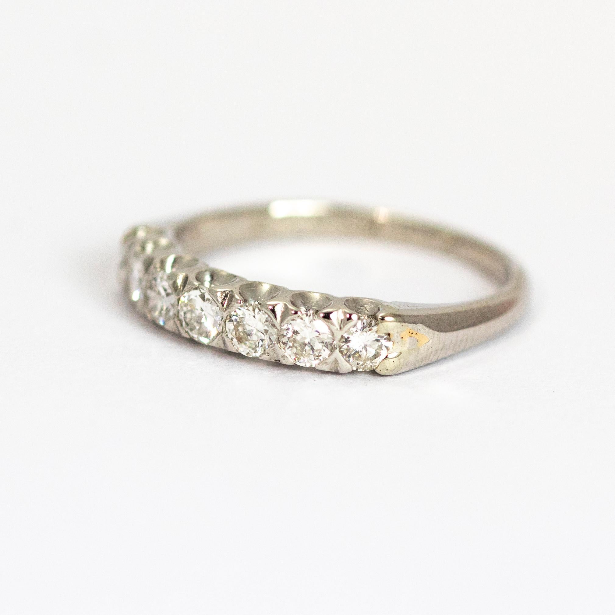 The seven bright diamonds really sparkle in this ring, each diamond measures 10pts and the ring holds a total of 70pts worth of diamonds which are set flush into the band. This half eternity is modelled out of Platinum.

Ring Size: J 1/2 or 5
Band