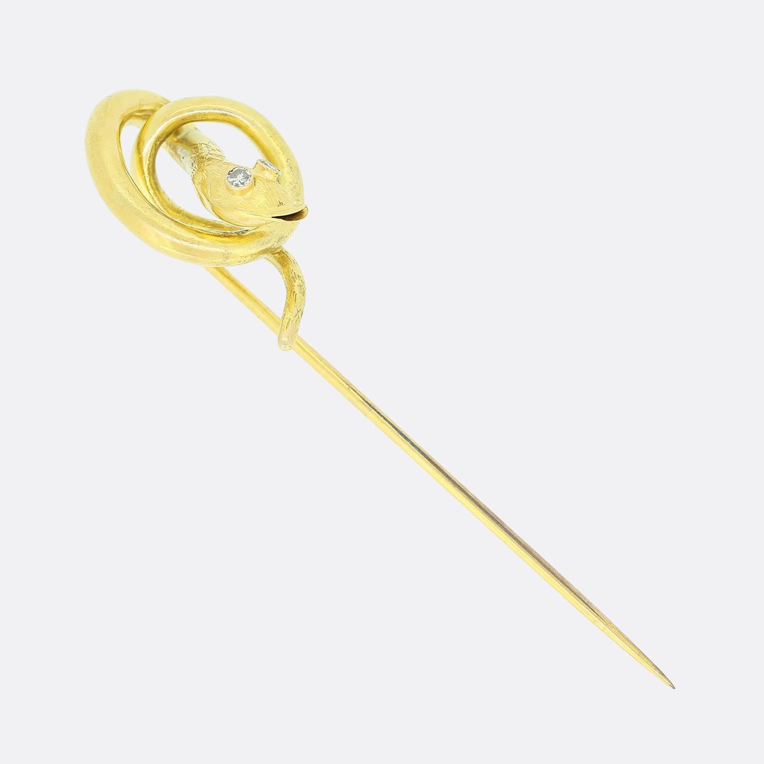 This is a Vintage gold diamond set snake stick pin. The stick pins head is in a snake motif and set with two single cut diamonds in the eyes and crafted in 18ct yellow gold. 

Condition: Used (Very Good)
Weight: 2.6 grams
Dimensions: 68mm x 15mm x