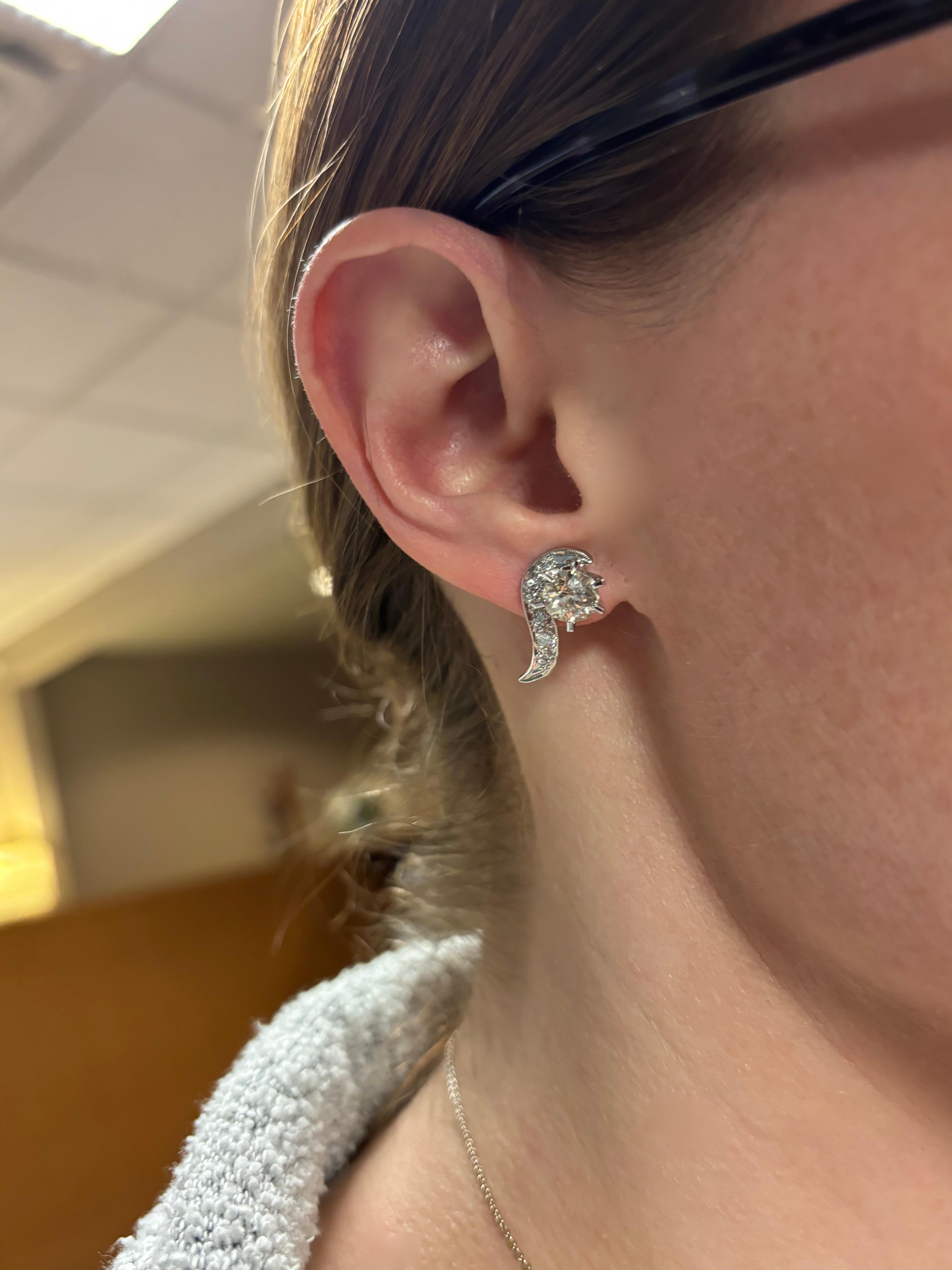 Vintage Diamond stud earrings made with 2.62CTW Old European & Round Brilliant cut diamonds. 

Gemstone: Earth Minded Diamonds 
Total Diamond Carat Weight: 2.62CTW 
Large Diamonds: 1.12ct Old European Cut, I Color, I1 Clarity 
1.01ct Old European