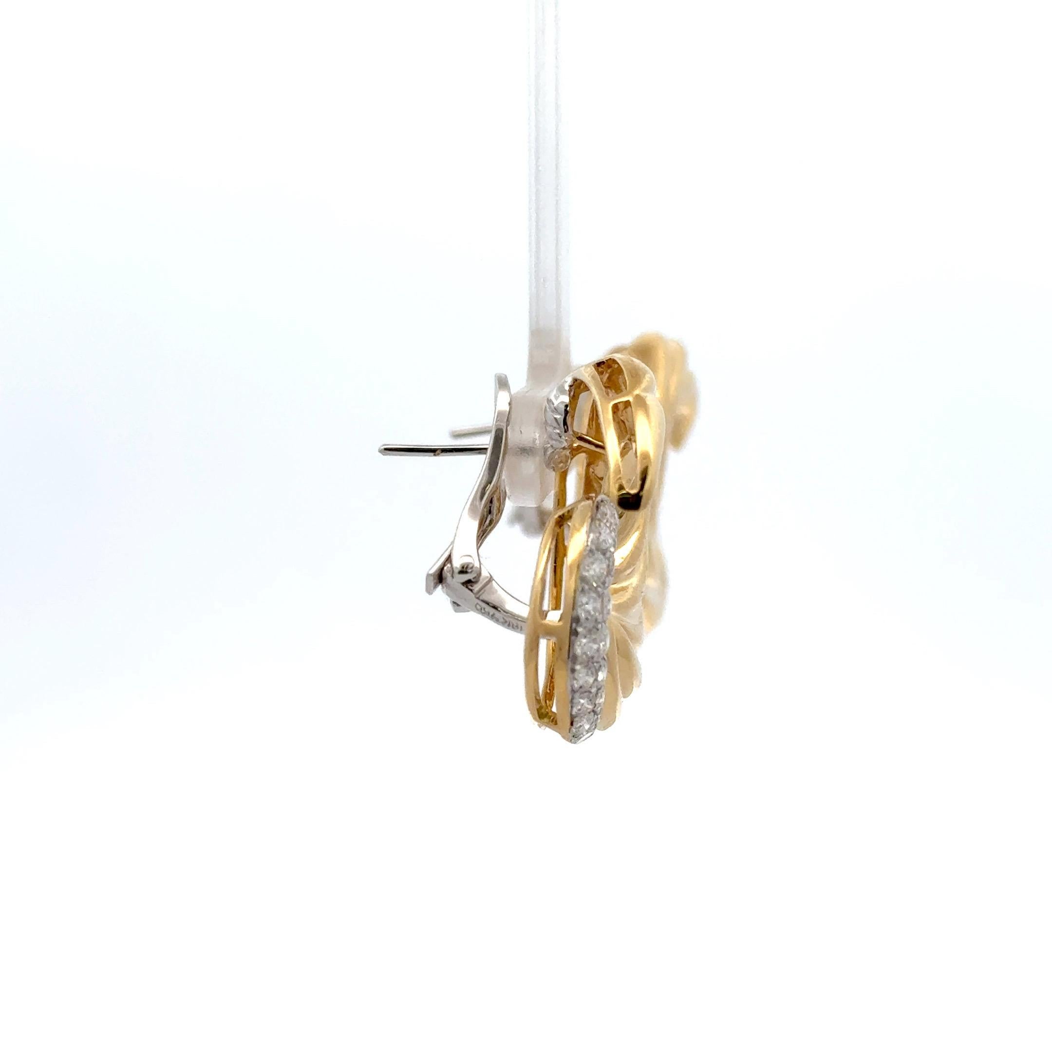 18 Karat yellow gold swirl earrings featuring 40 round brilliants weighing 1.37 carats. Can be clip or post. 