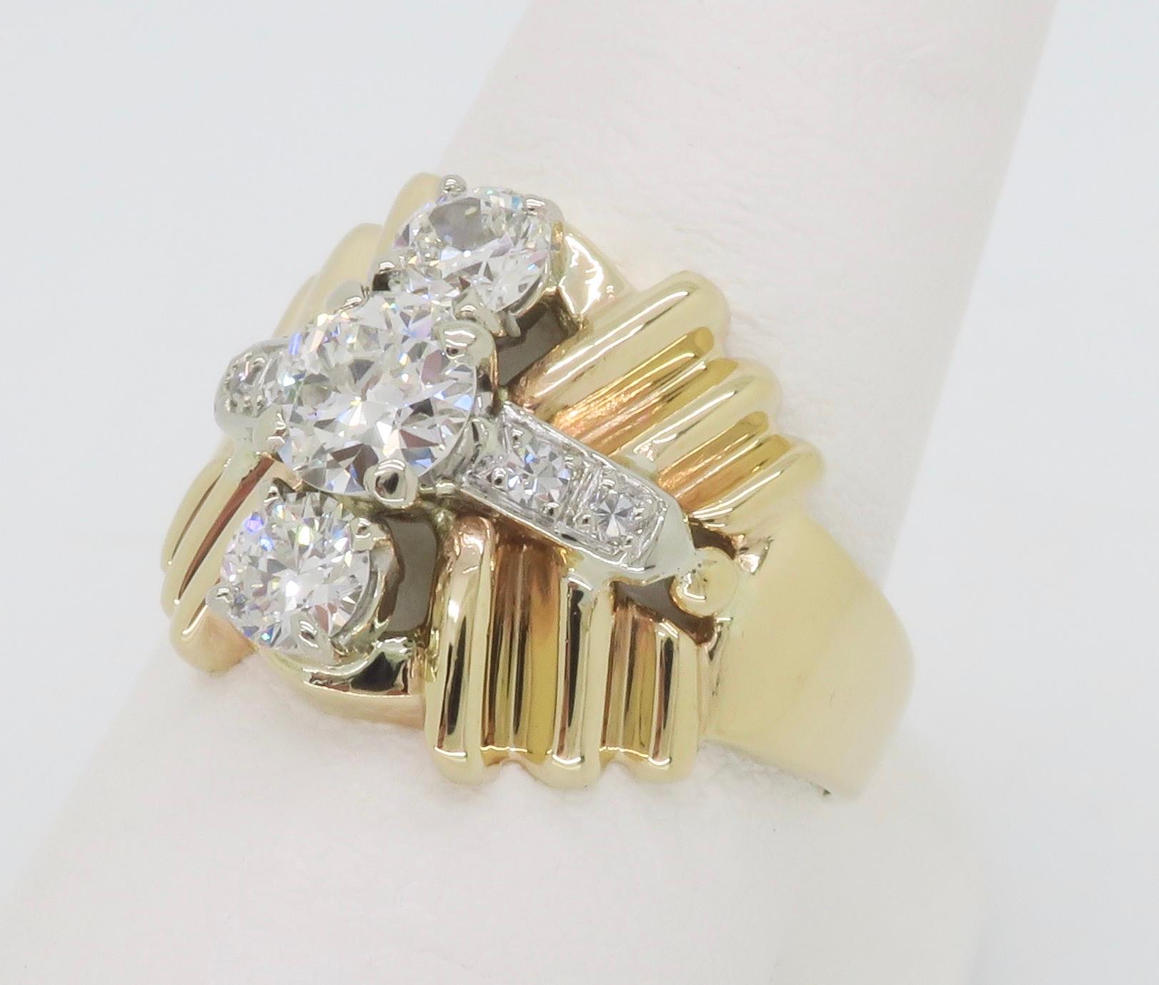 Unique vintage cluster ring crafted in 14k yellow gold. 

Center Diamond Carat Weight: Approximately .50CT
Center Diamond Cut: Old European Cut 
Center Diamond Color: H
Center Diamond Clarity: VS2
Total Diamond Carat Weight: .83CTW
Metal: 14k Yellow