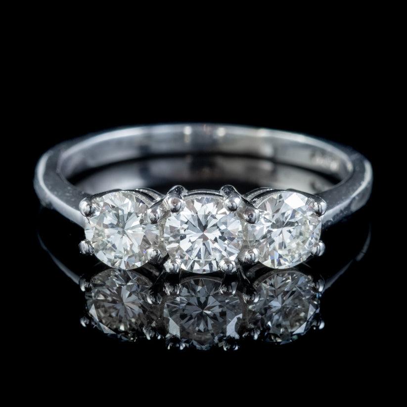 A stunning vintage trilogy ring boasting three exceptional brilliant cut diamonds that glisten endlessly in the light. The perfectly matched stones are approx. 0.50ct each (1.50ct total) and have a clean, bright sparkle with excellent VS1 clarity -