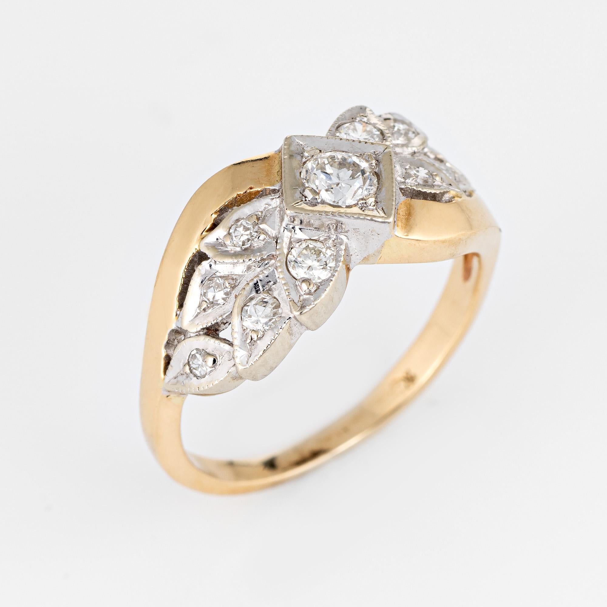 Elegant vintage diamond wedding band (circa 1930s to 1940s) crafted in two-tone 14k yellow & white gold. 

7 old European & single cut diamonds range in size from 0.10 (center) to 0.01 carats. The total diamond weight is estimated at 0.20 carats