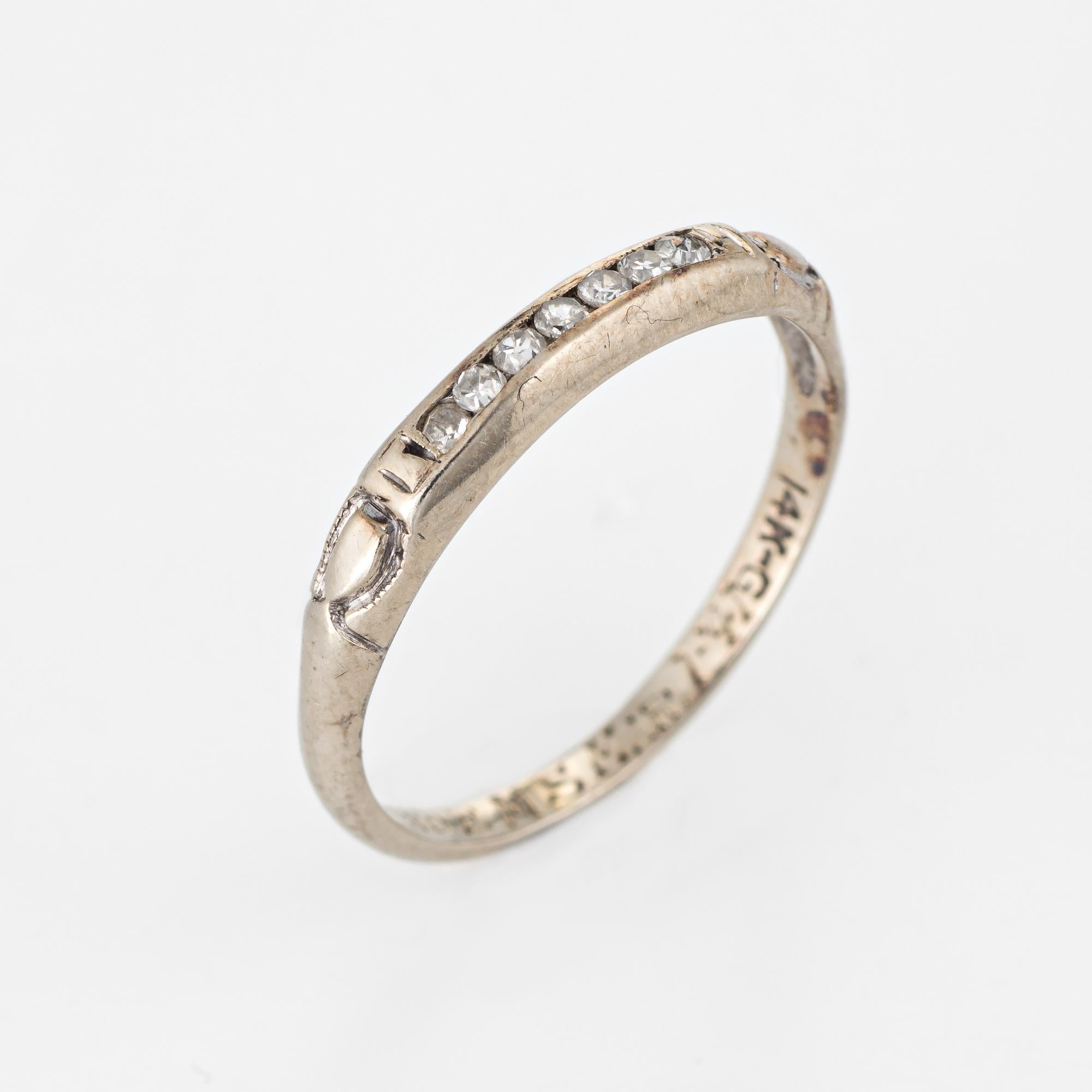Elegant vintage diamond wedding band (circa 1941) crafted in 14 karat white gold. 

7 single cut diamonds are estimated at 0.01 carats each and total an estimated 0.07 carats. The diamonds are estimated at H-I color and VS2-SI1 clarity.

The ring