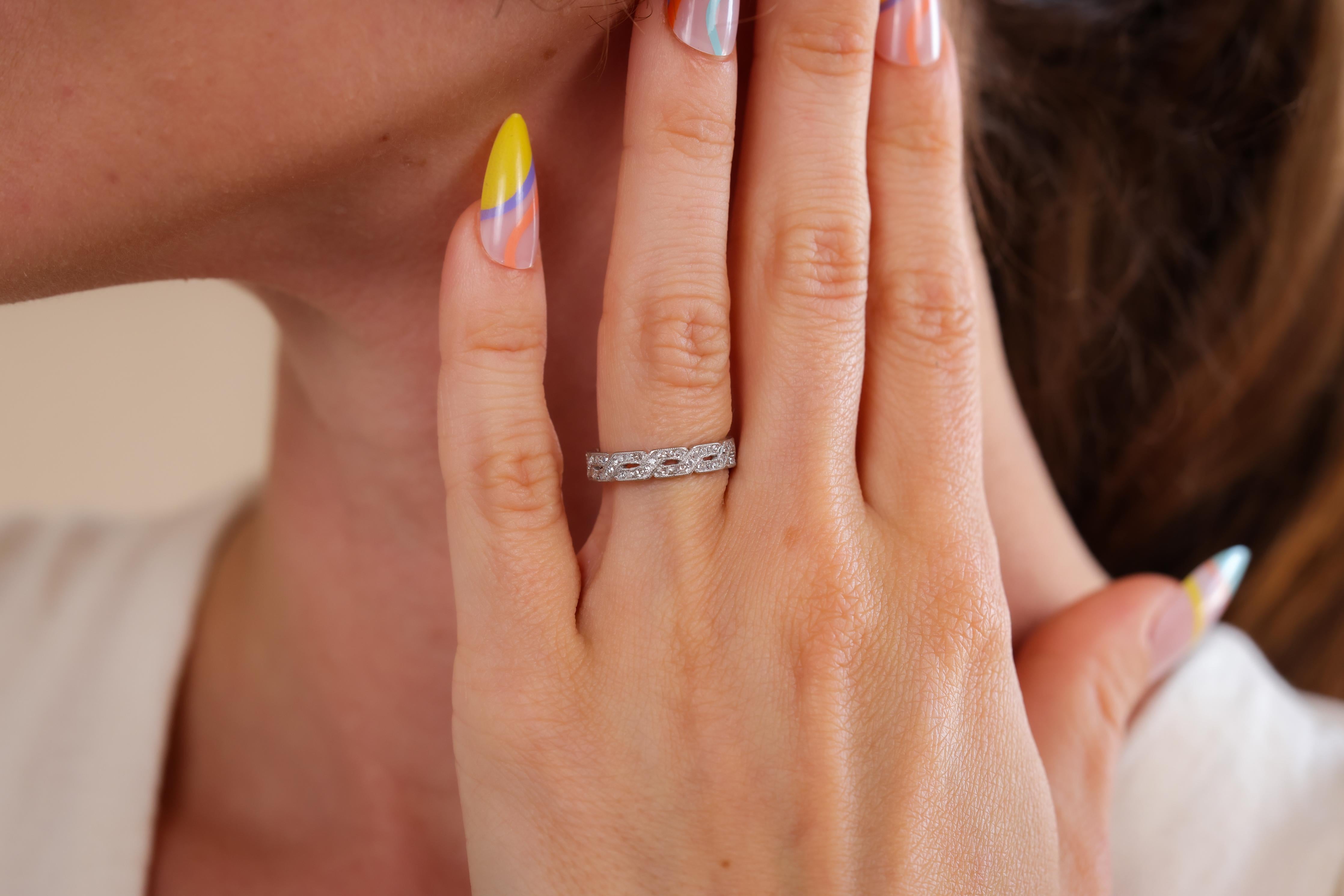 Center Stone: 88 Diamonds
Cut: Single
Weight: Approximately 0.90 Carats 
Color: F-G
Clarity: VS
Metal: 18k White Gold 
Era: Mid-Century 
Circa: 1960s 
Size: 5-1/2
Gram weight: 2.7
 
This elegant Mid-Century ring from the 1960s features a stunning