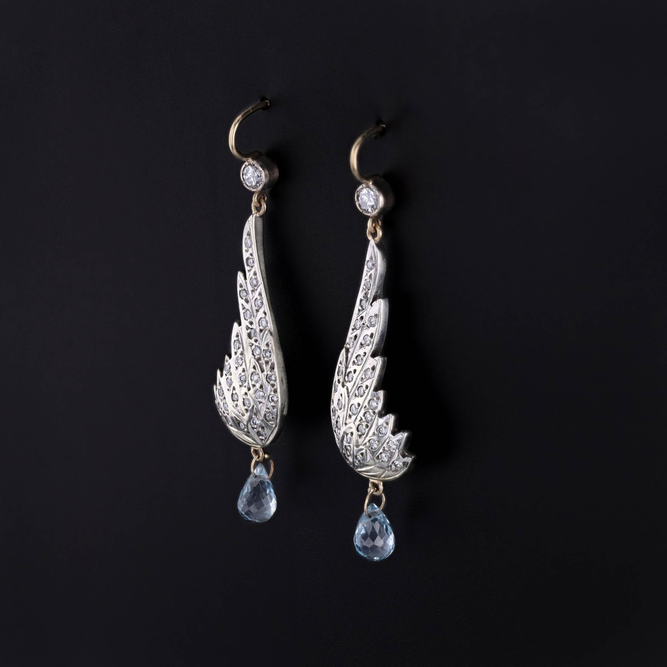 Diamond and Blue Topaz Wing Earrings Transformed from a Vintage Brooch (circa 1930)

These striking earrings offer a seamless blend of antique provenance and modern luxury, ideal for the discerning collector. 

Meticulously reimagined from a 1930s