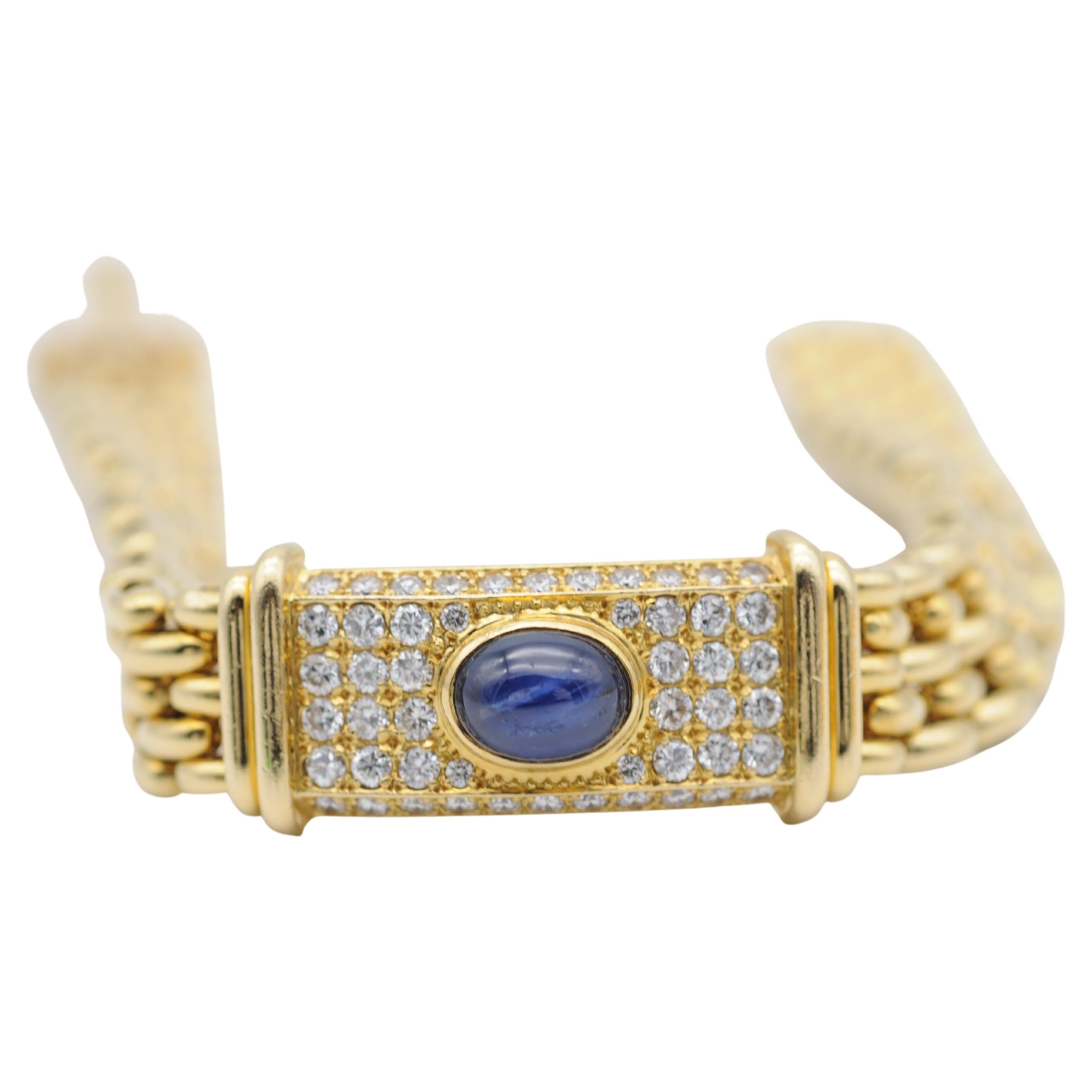 Introducing the stunning Royal 18k Yellow Gold Bracelet with Sapphire and Diamonds - a masterpiece of elegance, luxury, and sophistication. Crafted with the finest attention to detail, this bracelet boasts a wide link design that is sure to catch