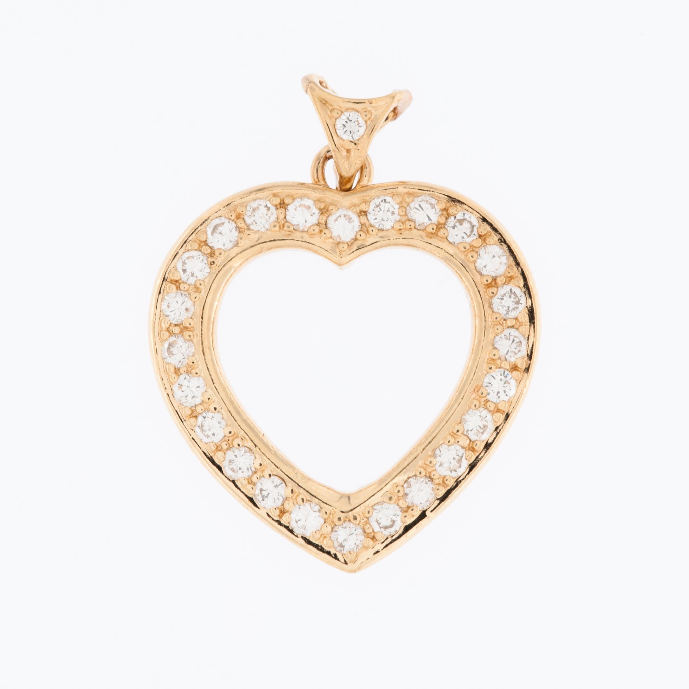 The Vintage Diamonds Heart Pendant in 18kt Yellow Gold exudes timeless elegance and romantic charm. Crafted with meticulous attention to detail, this exquisite pendant showcases a classic heart-shaped design that transcends trends and epitomizes