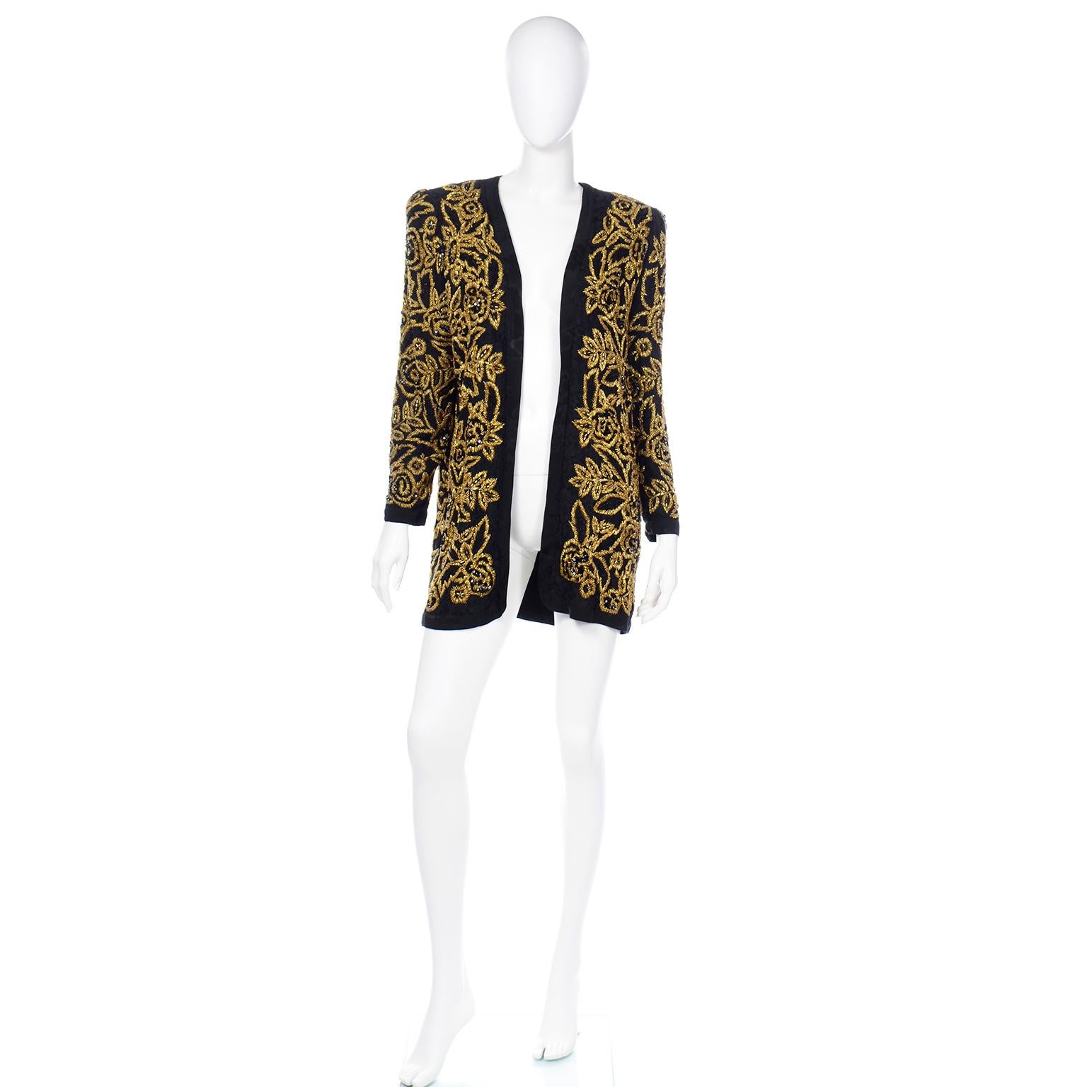 This stunning vintage Diane Freis open front evening jacket in a lovely black lace, covered with black and gold beads that are embroidered into a floral design.soutache embroidered base fabric. The lining is a black tonal silk jacquard floral print