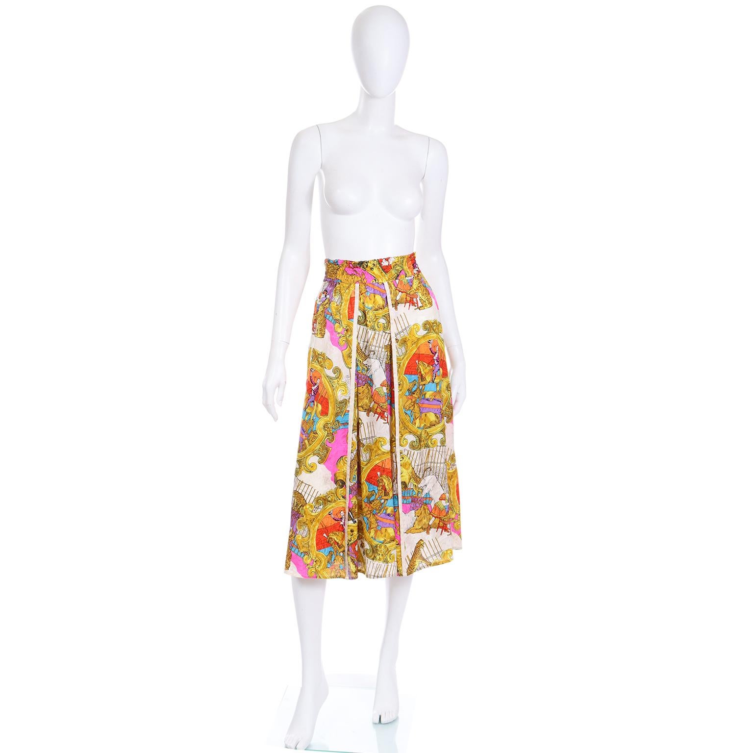 This is a fun vintage Diane Freis novelty circus print silk skirt with the Freis signature elastic waistband that fits a range of sizes. The skirt is a white jacquard tonal print featuring the circus including a ringmaster on a horse, tigers, lions,