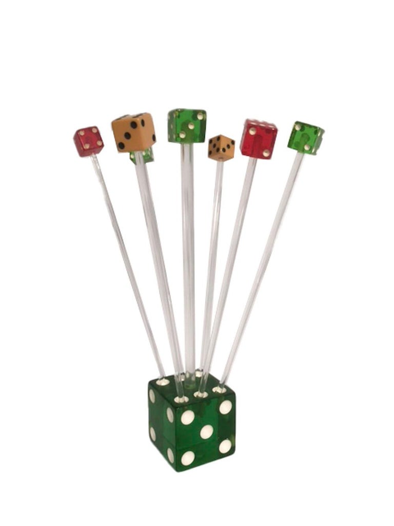 Vintage set of 6 swizzle sticks. The dice cocktail set, made by Exclusive Playing Company in its original box. Six swizzle sticks in clear Lucite with colored dice on top stand in holes in a large die with a clear handle topped with a smaller die