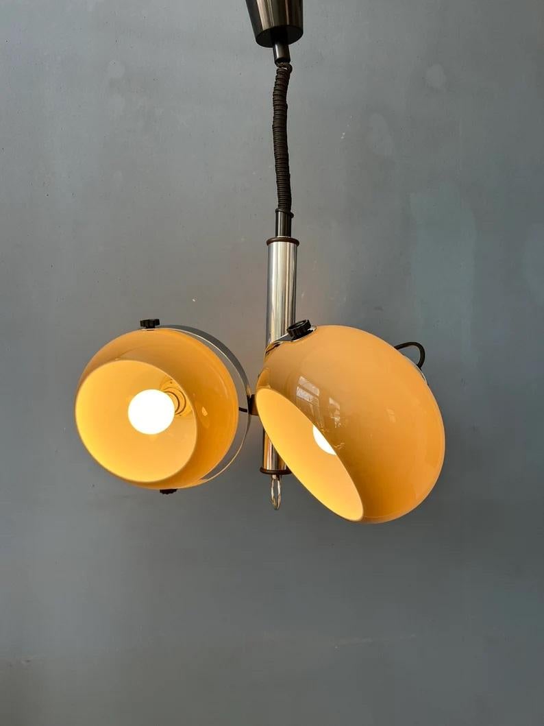 A very rare Dijkstra space age chandelier with three 'mushroom' shades. The acrylic glass shades produces a warm, cosy light and can be turned in any direction. The lamp requires three E27/26 (standard) lightbulbs.

Additional