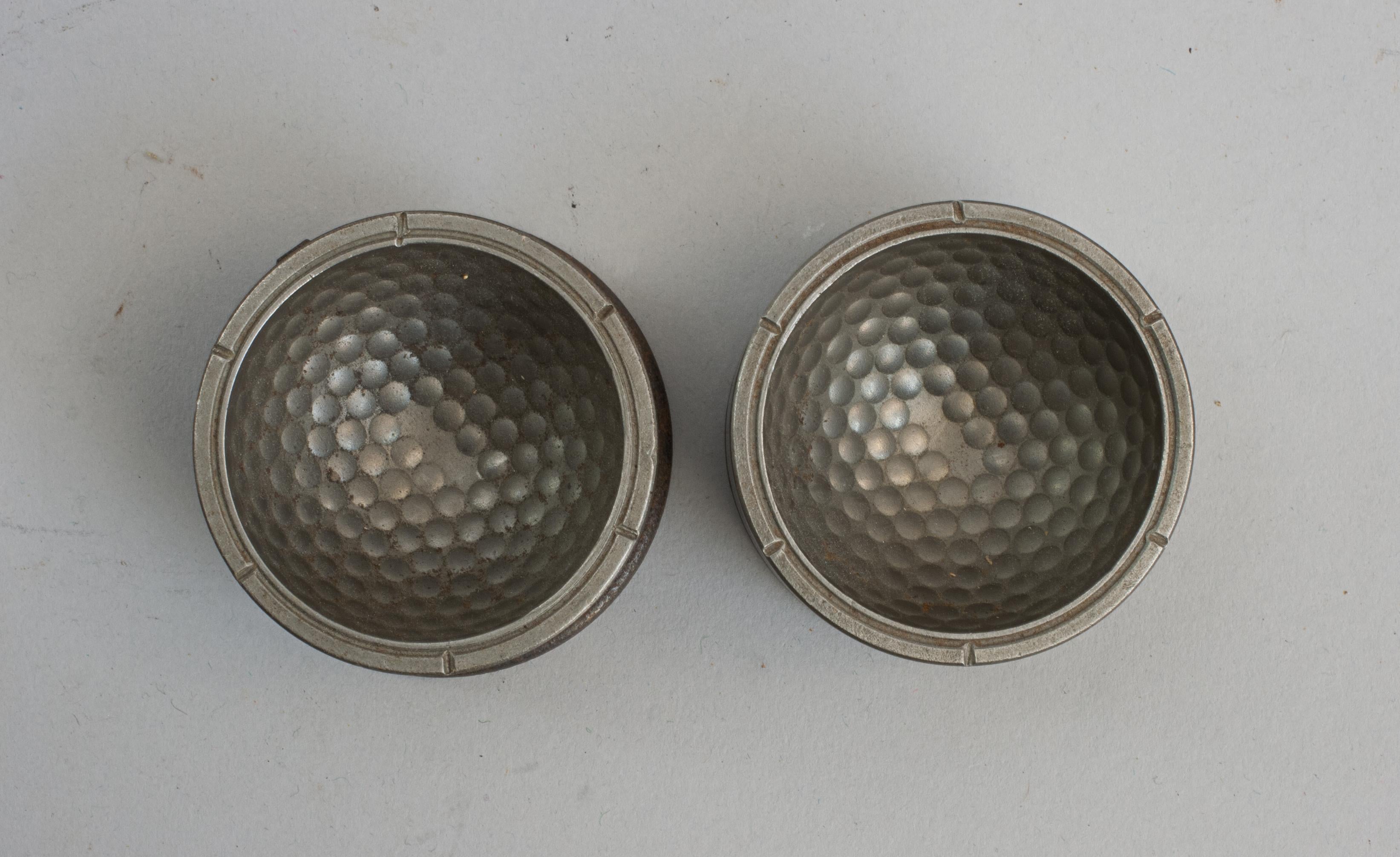 Vintage Two-Part Dimple Golf Ball Mould.
An interesting un-named dimple pattern golf ball mould. The steel moulds with locating slots to ensure the correct alignment of the pattern, both parts stamped with a 'B' to the base. Internally one part