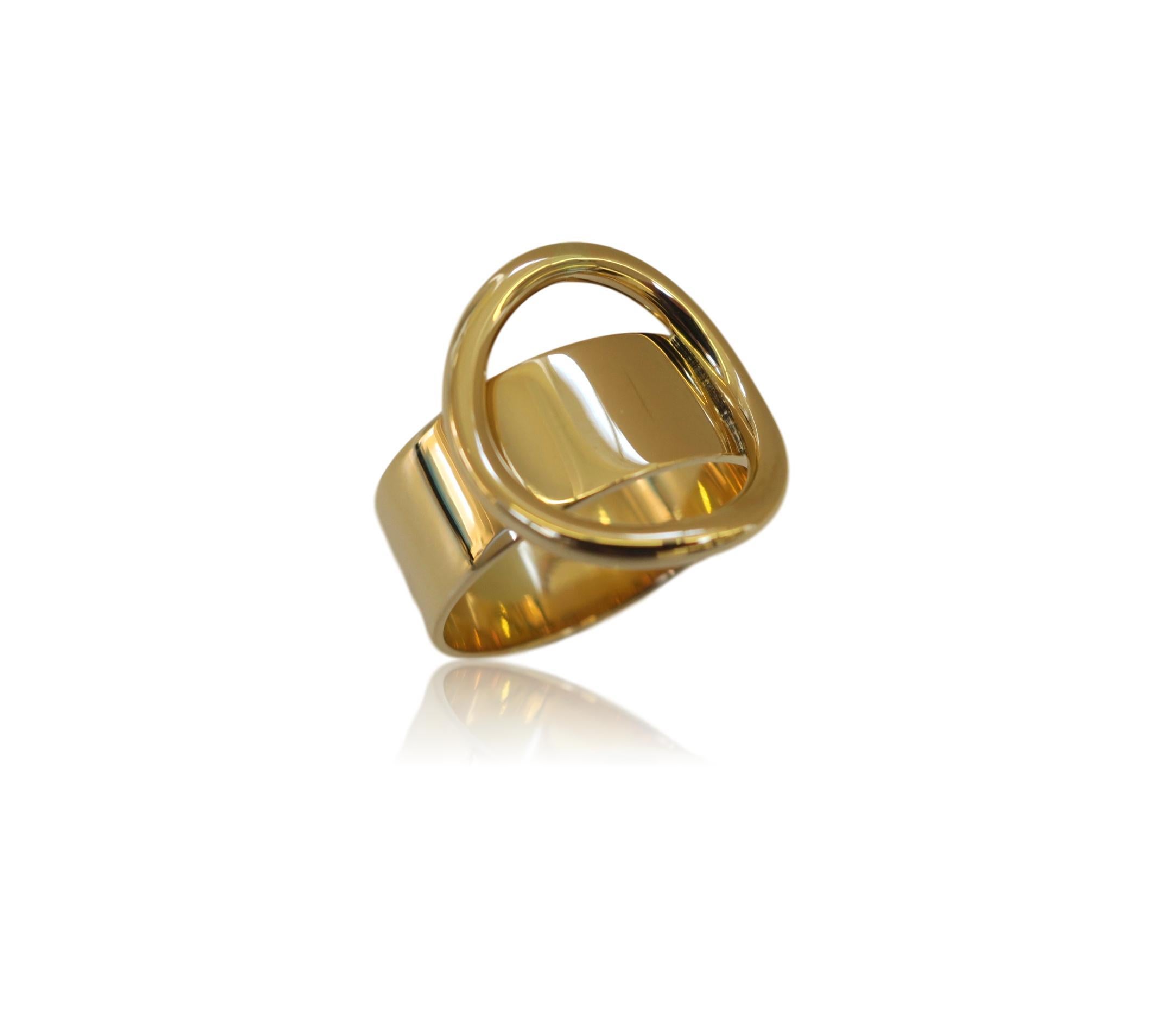 1970's gold Cartier ring by Dinh Van. The Modernist 18k mirror finished yellow gold ring with a 3/4