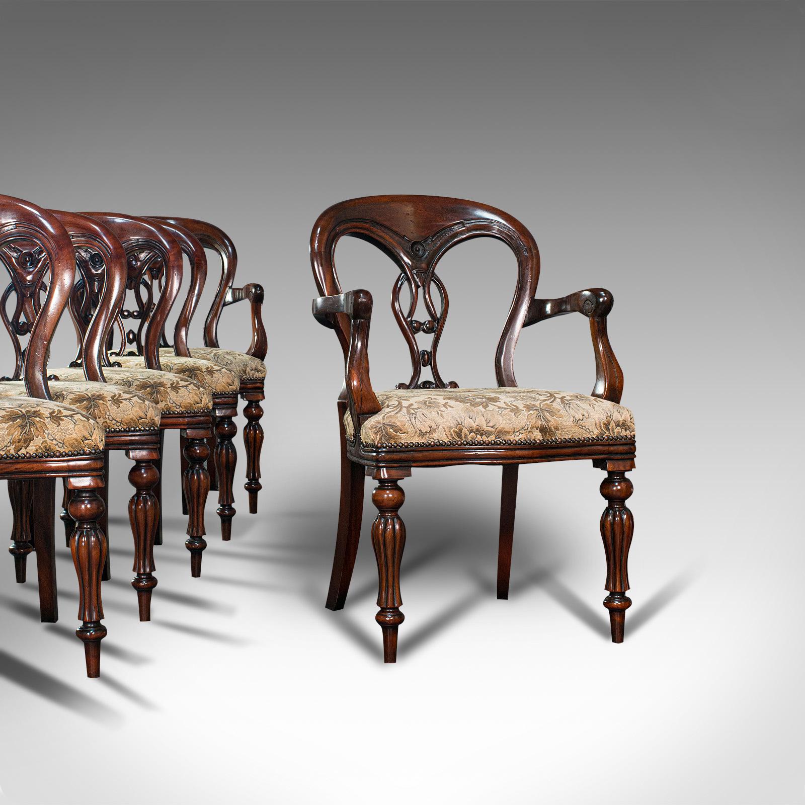 This is a superb vintage dining chair set. An English, quality mahogany and upholstered pair of carvers with 4 seats in Regency revival taste, dating to the late 20th century, circa 1980.

Wonderfully classical taste with appealing