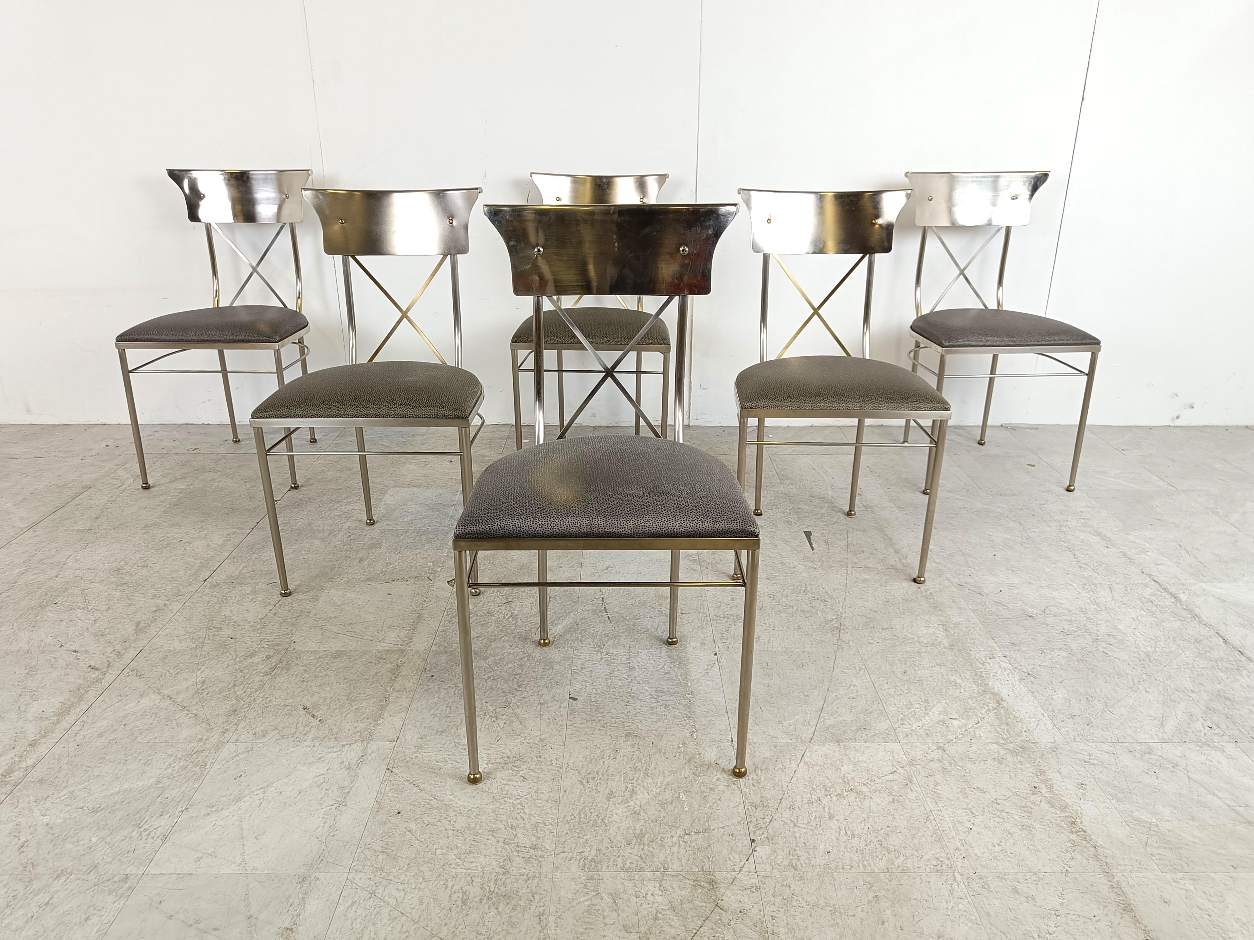 
Set of 6 rare dining chairs by Belgochrom with brushed steel frames, brass cross and aluminum backrests and their original skaai upholstery. The upholstery can be changed into plain fabric, bouclé,..- contact us for that.

Beautiful classical
