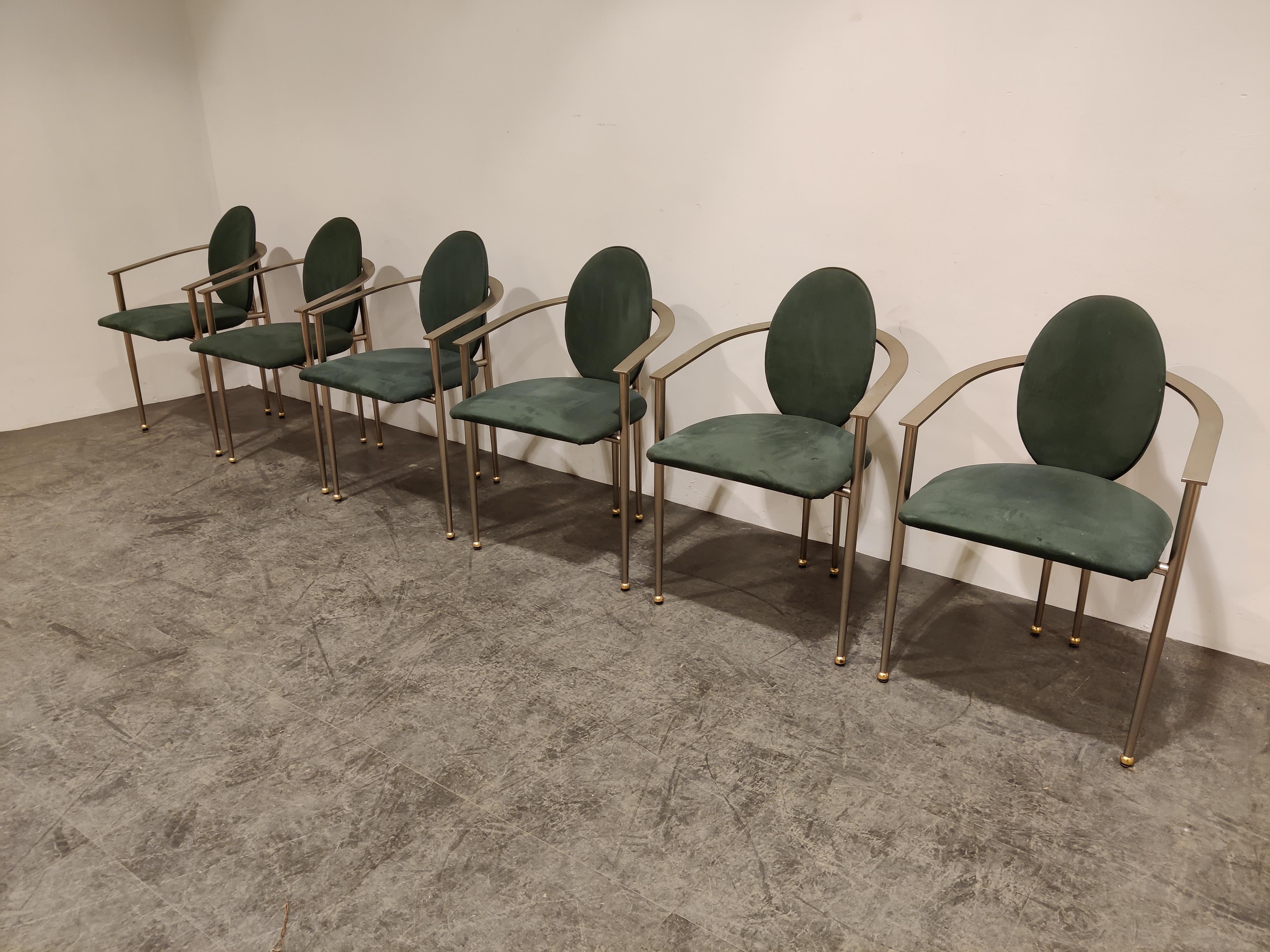 Set of six elegant dining room chairs manufactured by Belgochrom.

Nicely designed brushed steel frames with a brass shine and elegant legs. Uphosltered in green alcantara.

Belgochrom used to produce high end furniture and was the higher