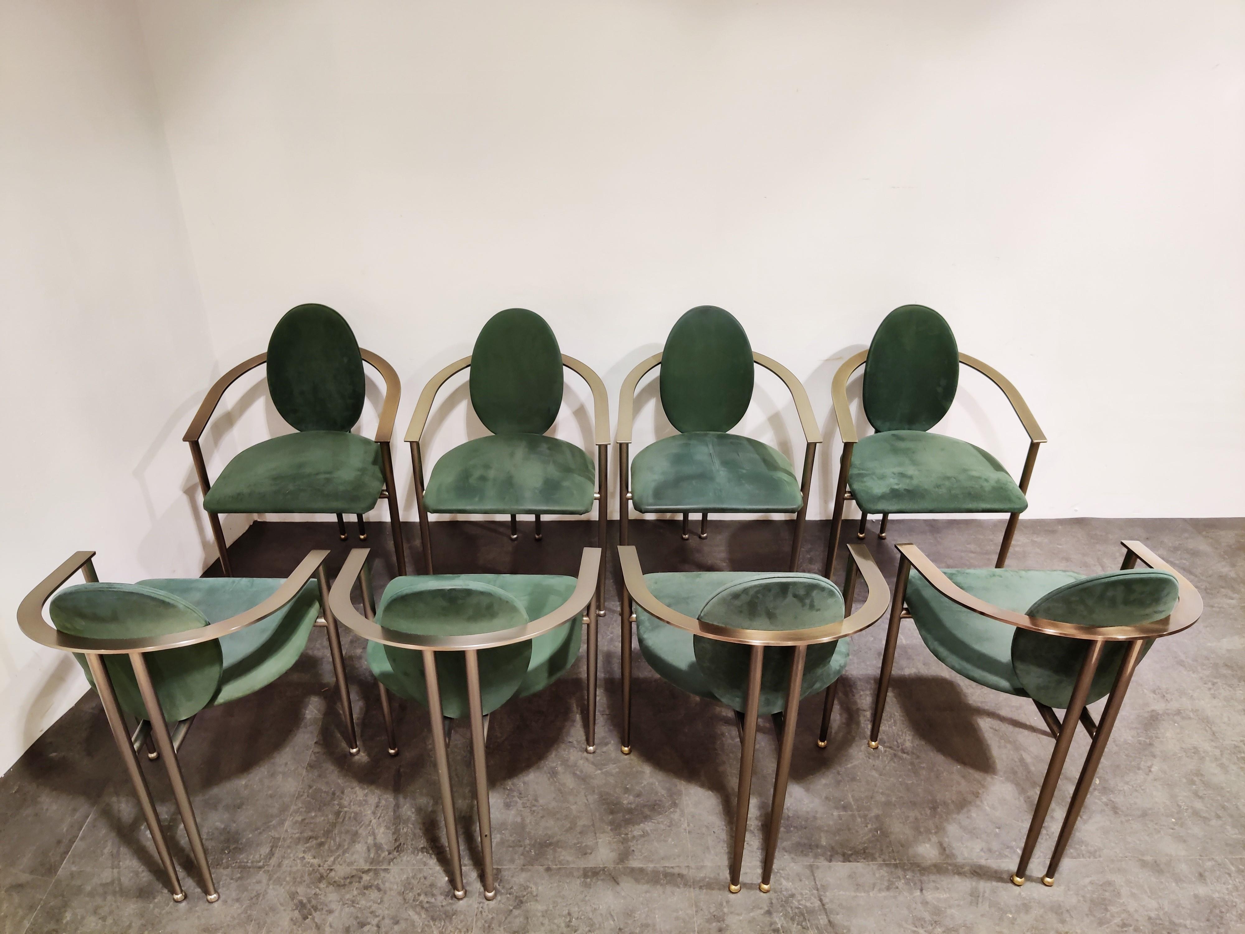 Set of eight elegant dining room chairs manufactured by Belgochrom.

Nicely designed brushed steel frames with a brass shine and elegant legs. Upholstered in green alcantara.

Belgochrom used to produce high end furniture and was the higher