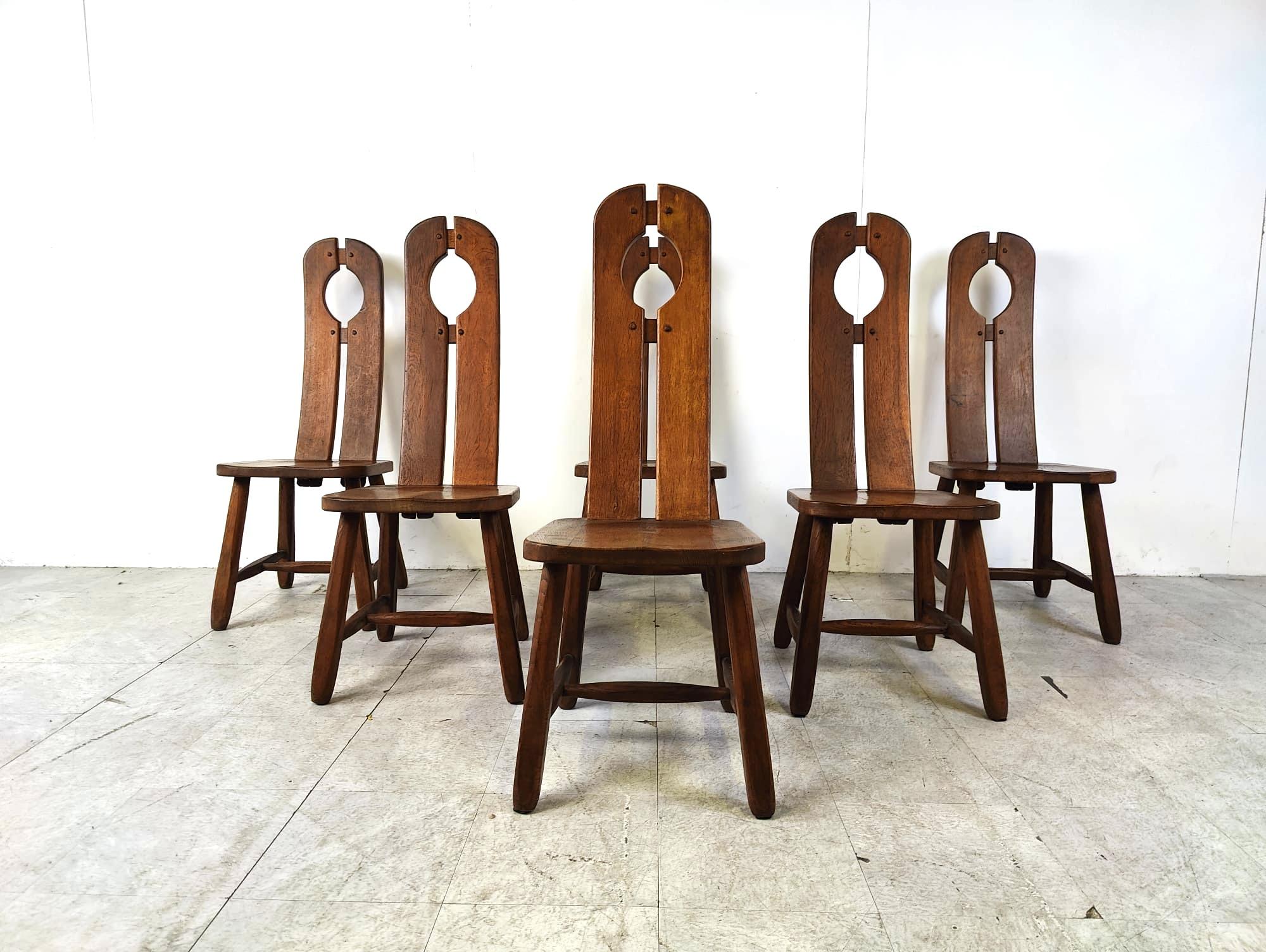Sturdy and handcrafted dining chairs produced by Depuydt Kunstmeubelen in Belgium.

The chairs are made from solid oak.

Beautiful split backs with interlocking wooden pieces.

These chairs and table will last for ages.

Good condition.

1960s -