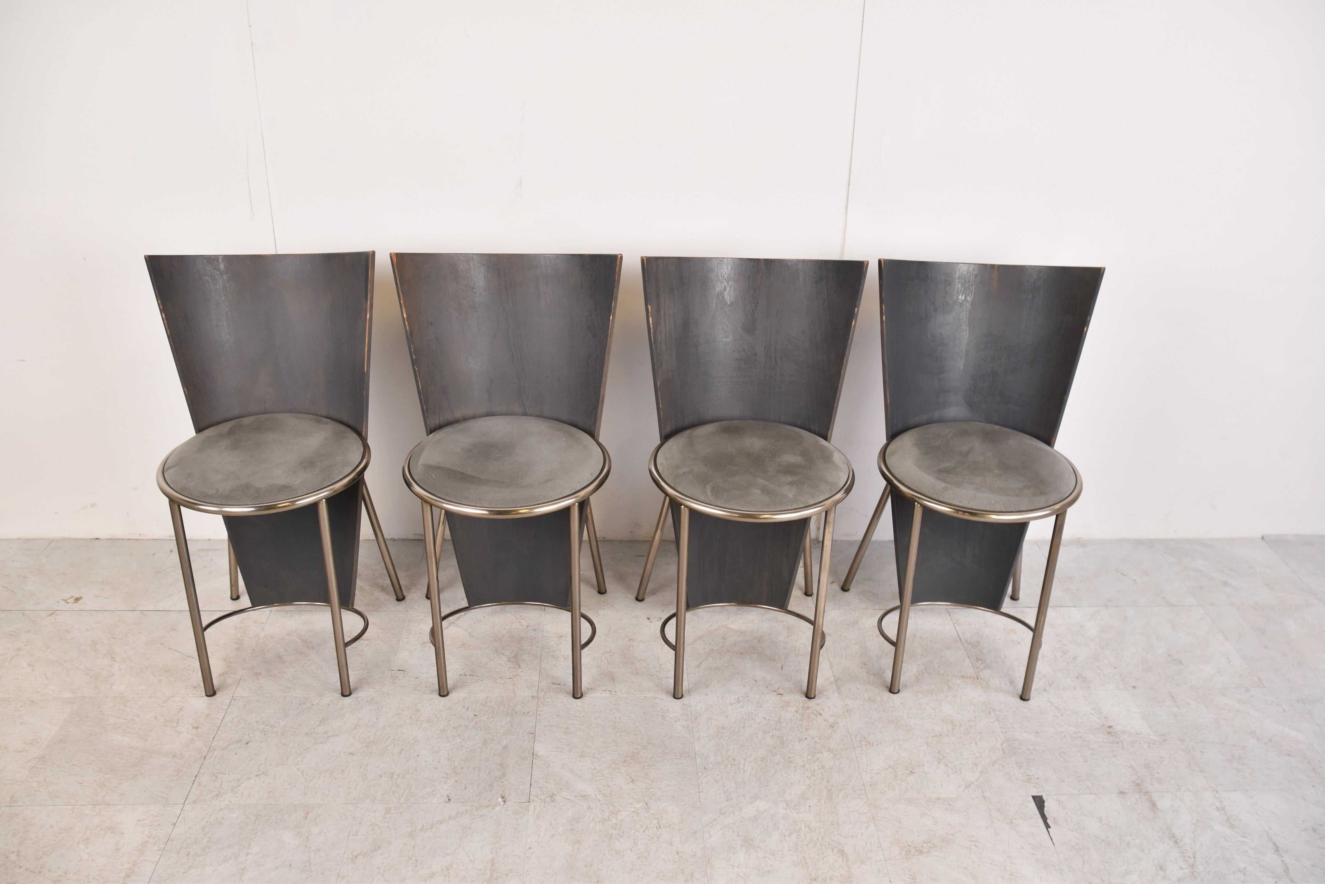 Set of four rare wooden version dining chairs designed by Frans Van Praet for belgochrom.

These chairs where designed for the world expo of 1992 in Sevilla.

The chairs have a beautiful geometric design and the seats have a grey suede
